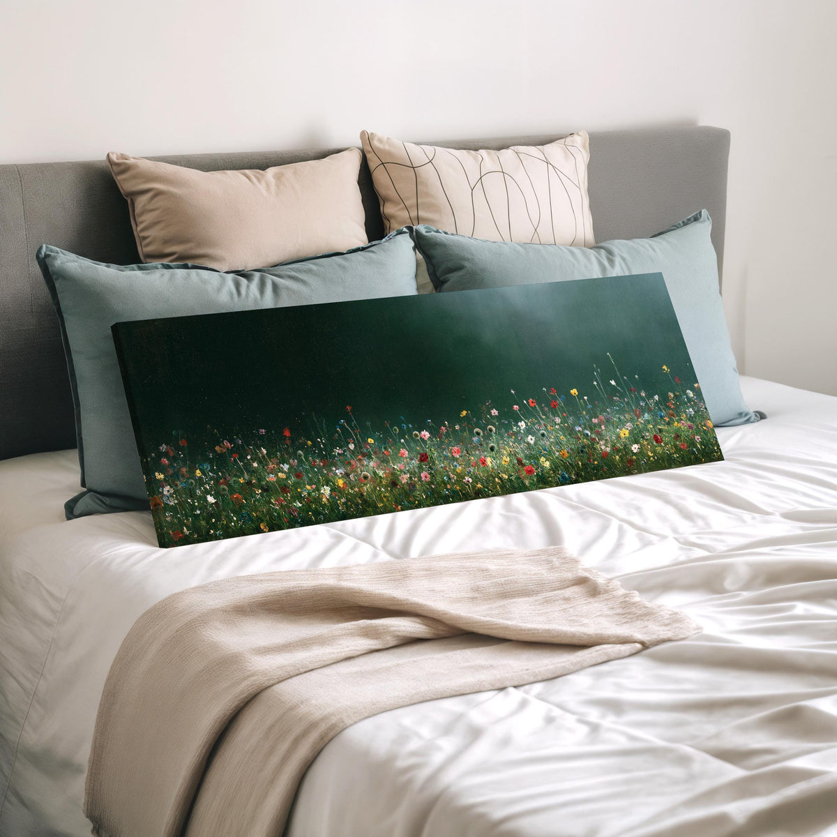 Wildflower field under a misty teal sky wide panoramic canvas print laid on a bed to show its size