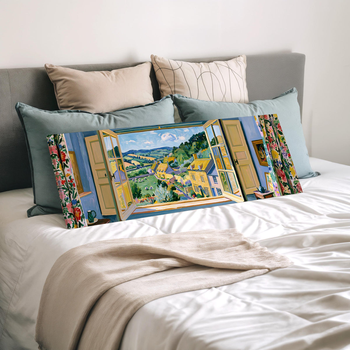English countryside village through a window wide panoramic canvas print laid on a bed to show its size