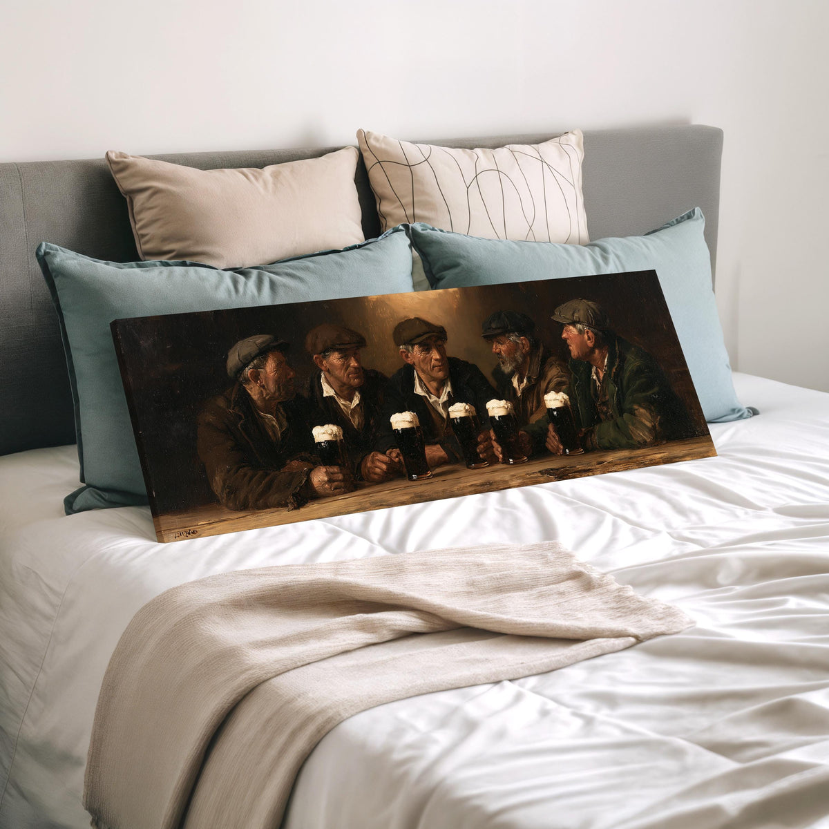 Friends toasting with stout in an Irish pub wide panoramic canvas print laid on a bed to show its size