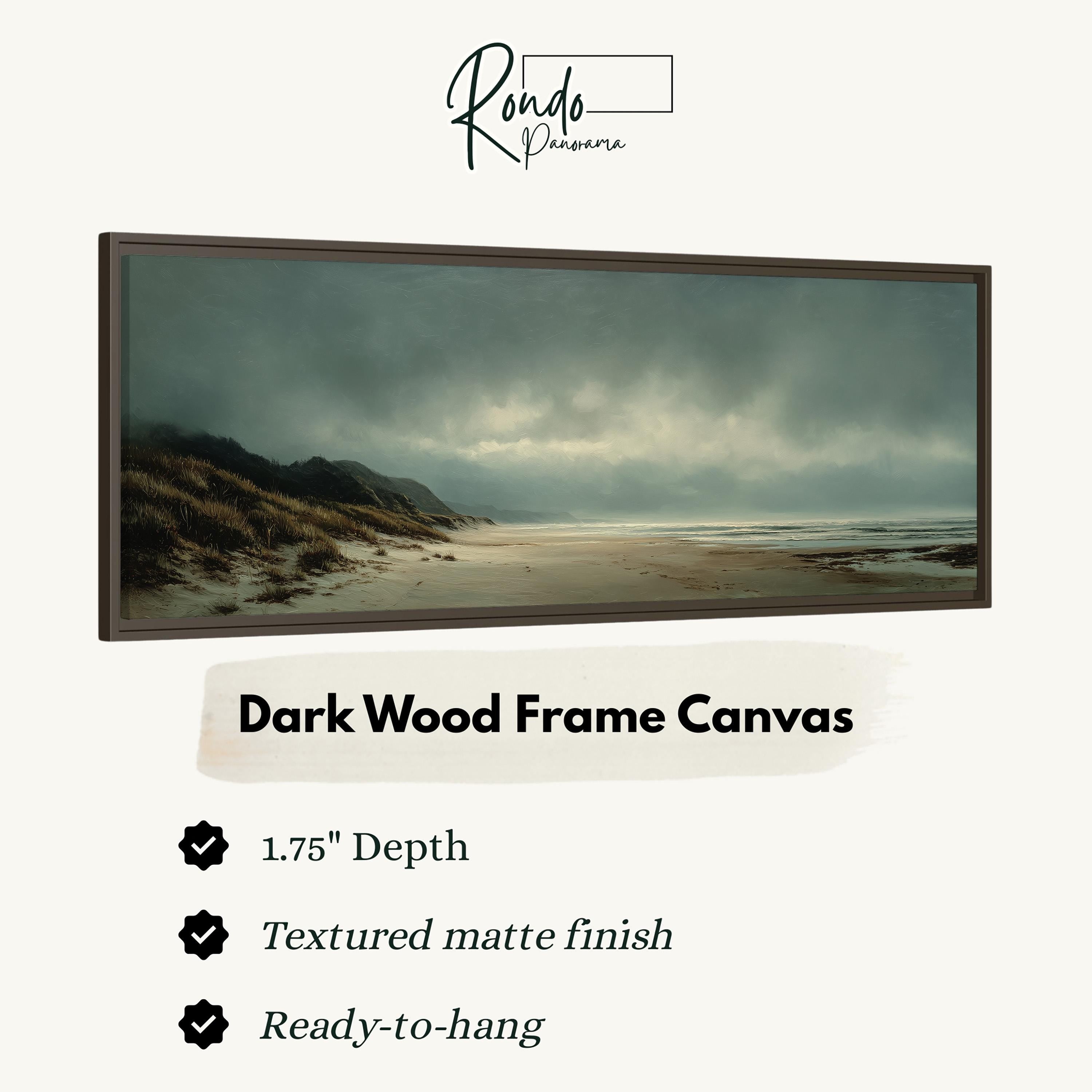 The image is a dark wood frame canvas depicting a beach scene with a cloudy sky.