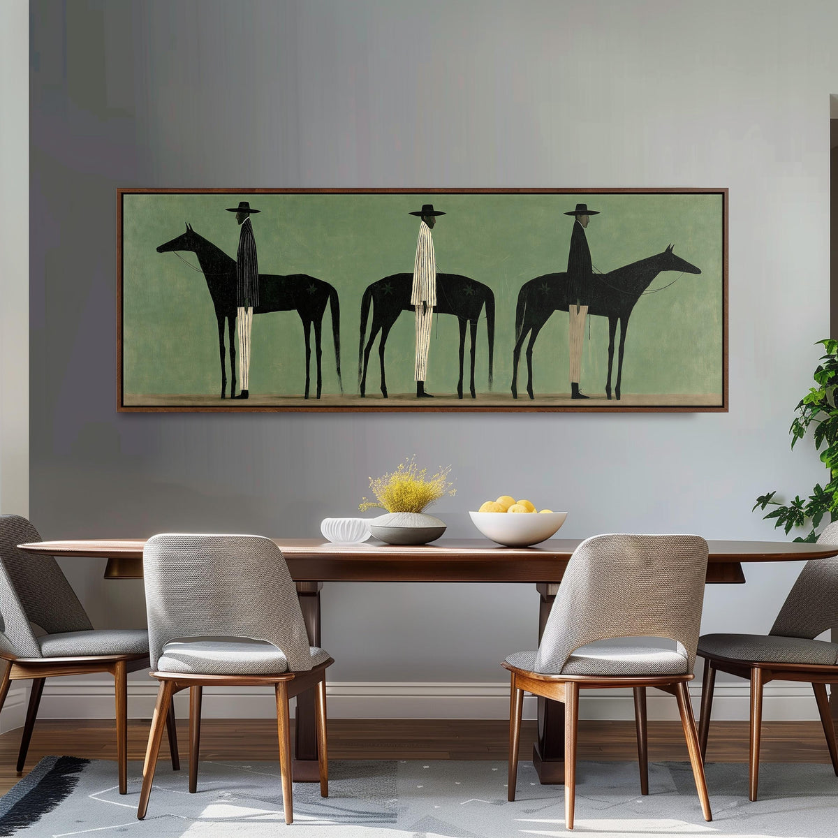 Three stylized cowboys with horses on sage green long horizontal canvas print above a dining table