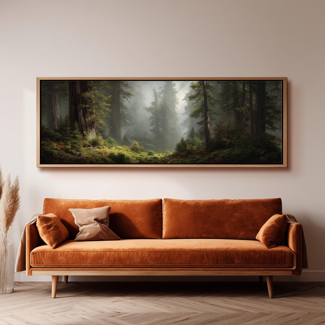 a dining room with a large painting of a forest scene hanging on the wall above a wooden table with four chairs. The painting depicts a misty forest with tall trees and a path winding through the undergrowth. The table is set with a bowl of fruit and a vase of flowers, creating a cozy and inviting atmosphere.