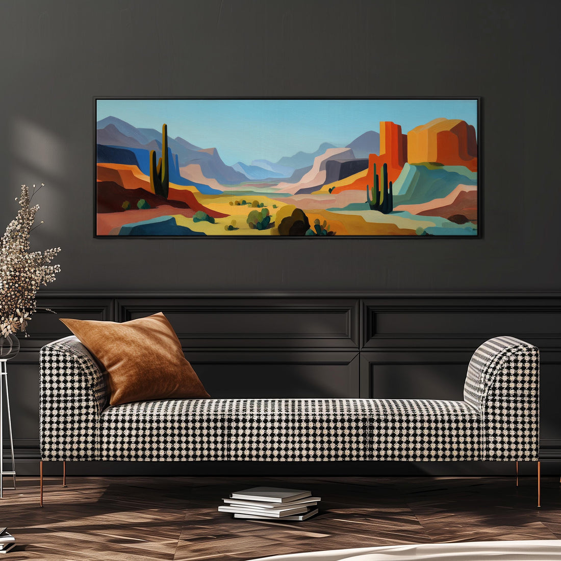 a large, colorful painting of a desert landscape hanging on a wall above a brown sofa.