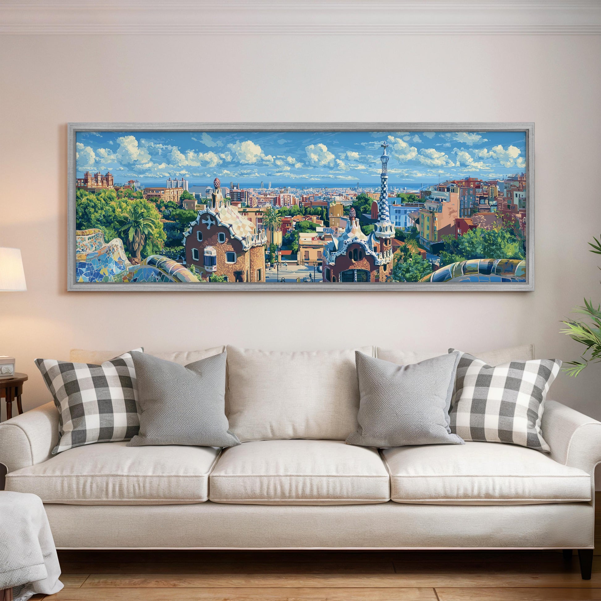 a large, colorful painting of a cityscape hanging on a wall above a white couch with patterned throw pillows.