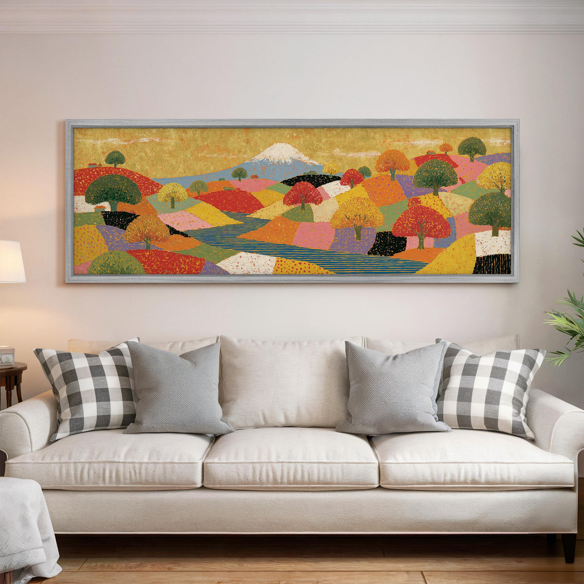 Mount Fuji over golden patchwork hills panoramic canvas print above a white sofa in a bright living room