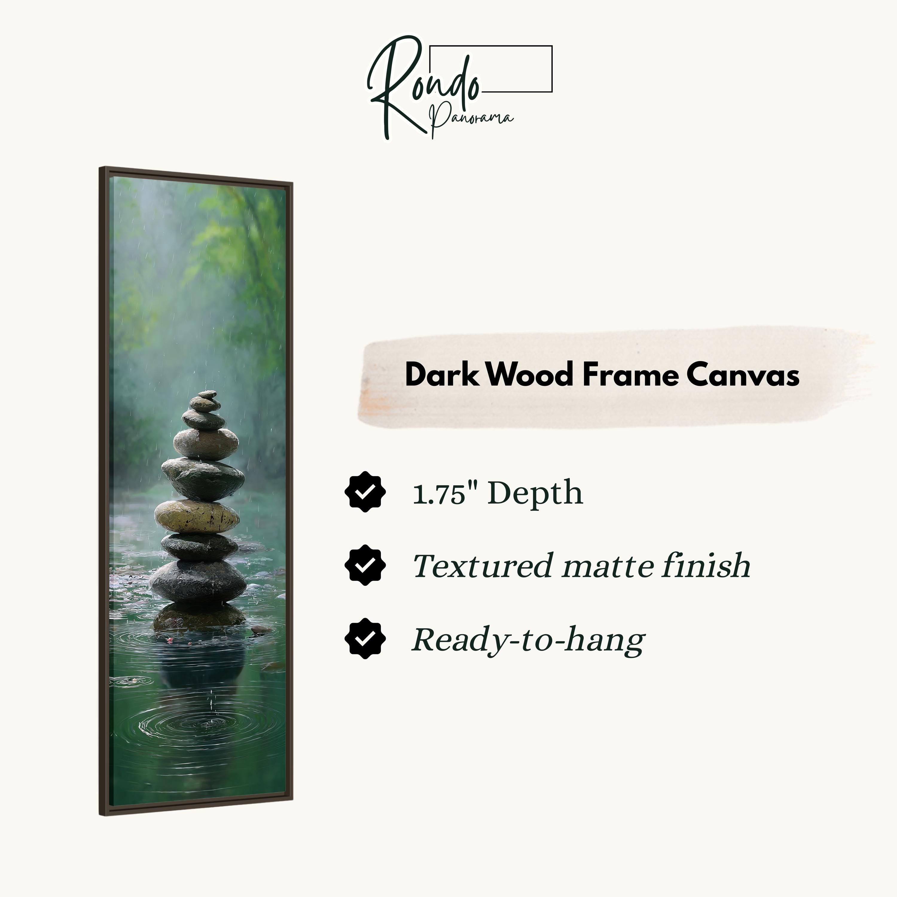 a dark wood frame canvas with a stone stack in a body of water, creating a serene and calming scene.
