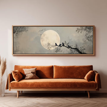 a large, framed painting of a moonlit night scene with birds perched on a tree branch.