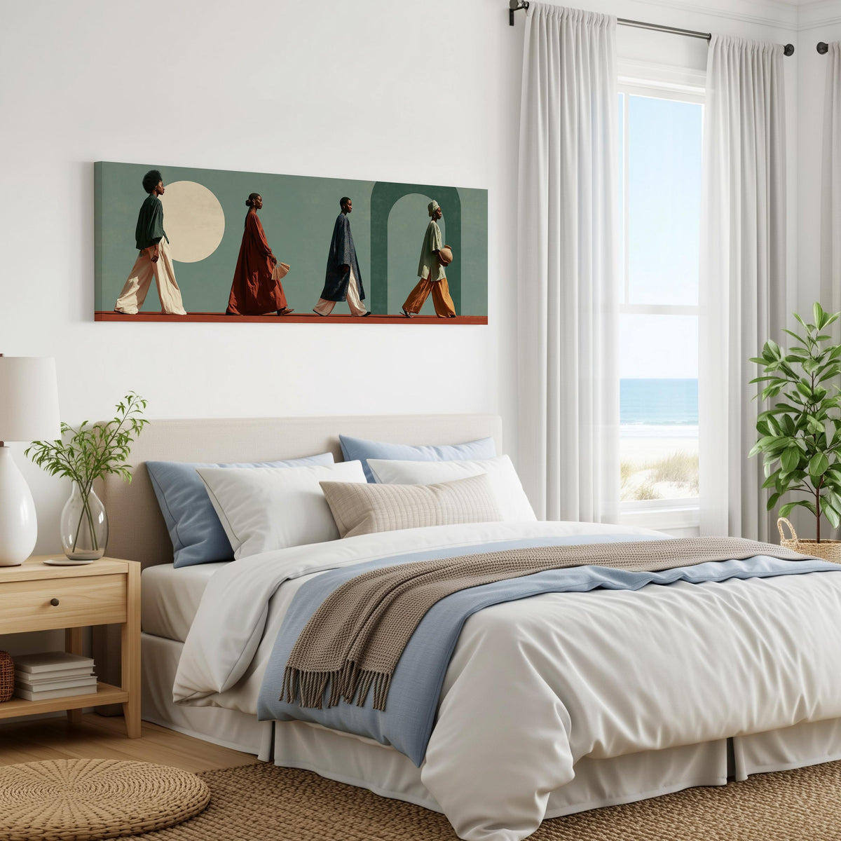 Women walking past arches and a pale moon panoramic canvas print above a bed in a coastal bedroom