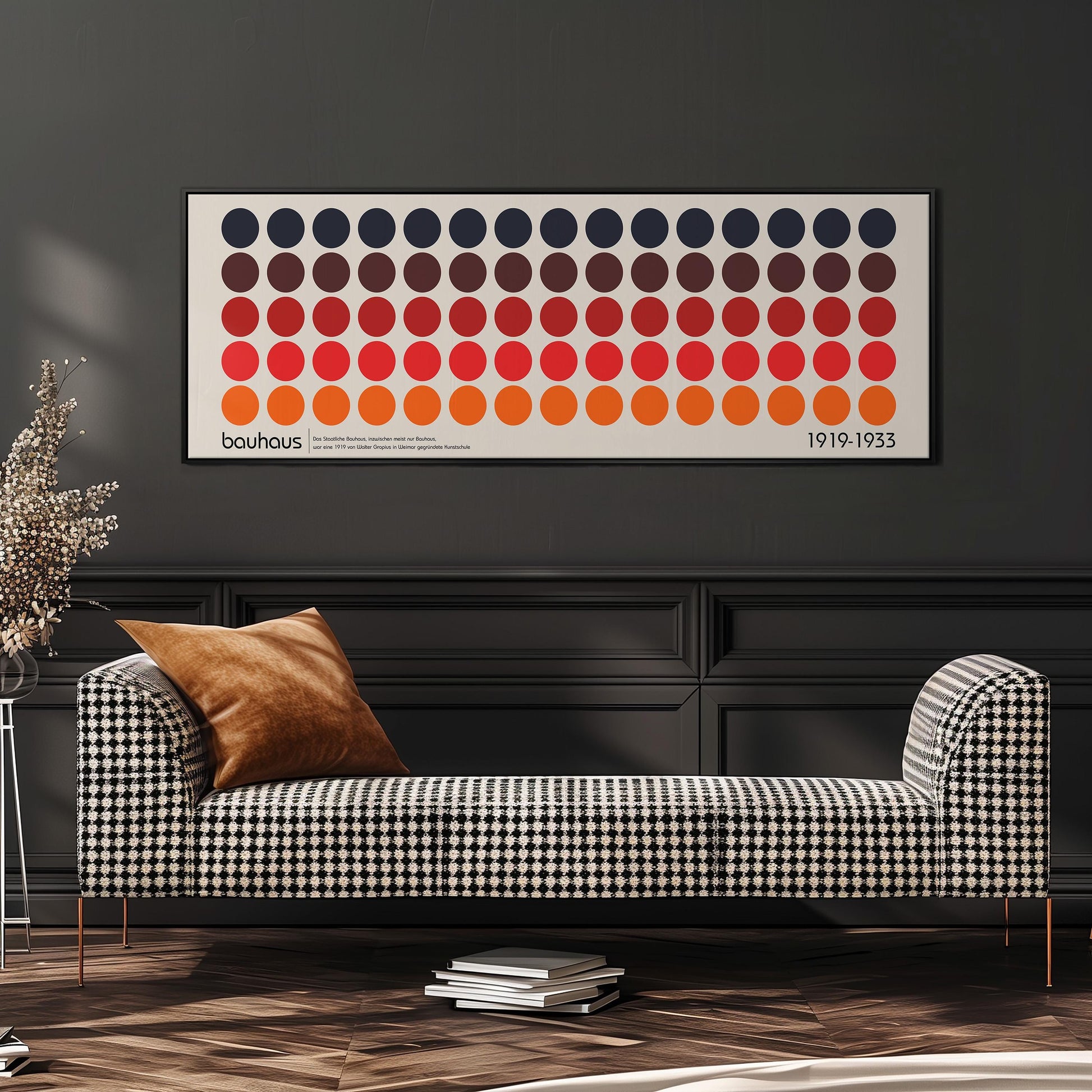 a modern living room with a checkered sofa, a stack of books, and a large abstract art print on the wall.