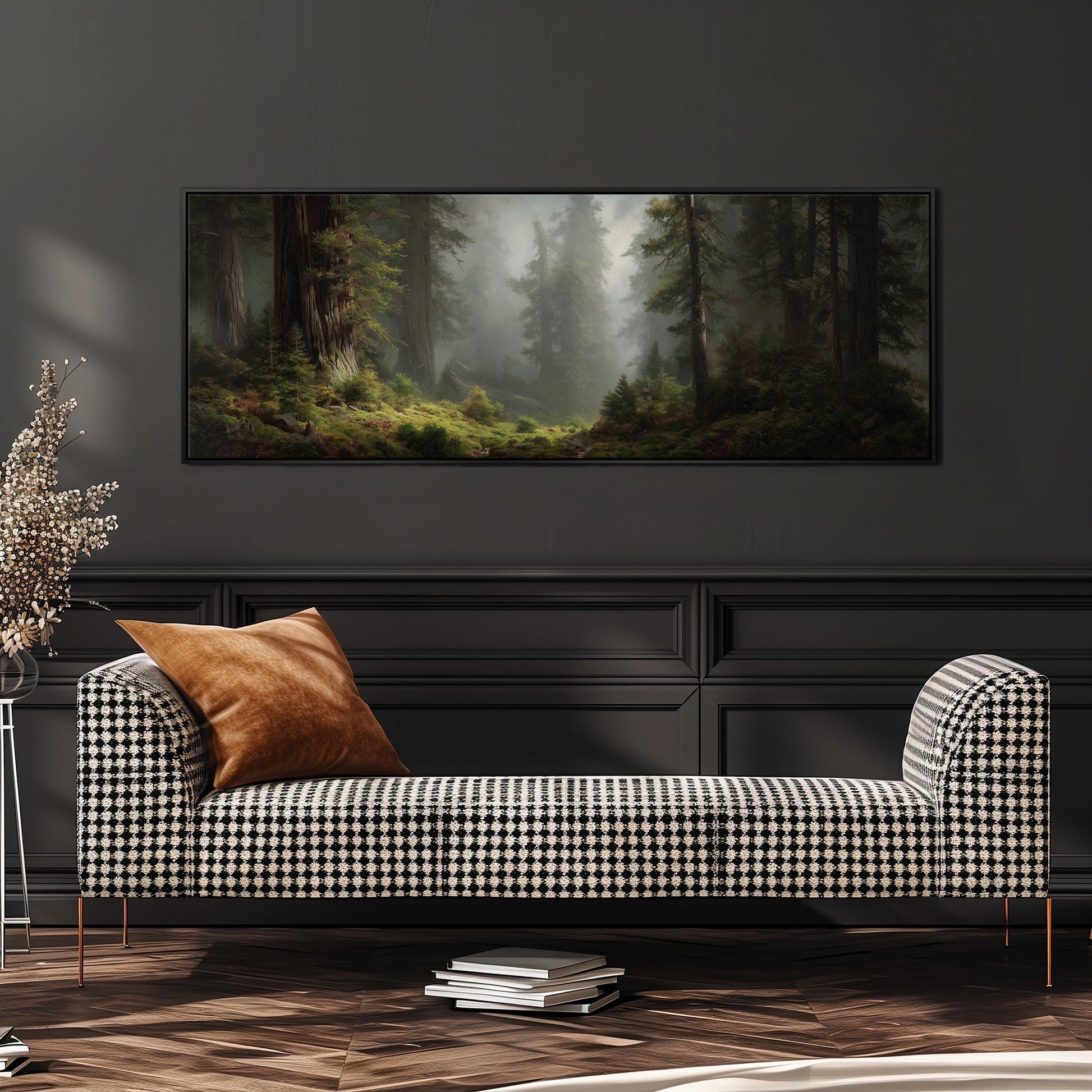 a cozy living room with a black and white checkered sofa, a stack of books, and a large painting of a forest scene hanging on the wall above the sofa.