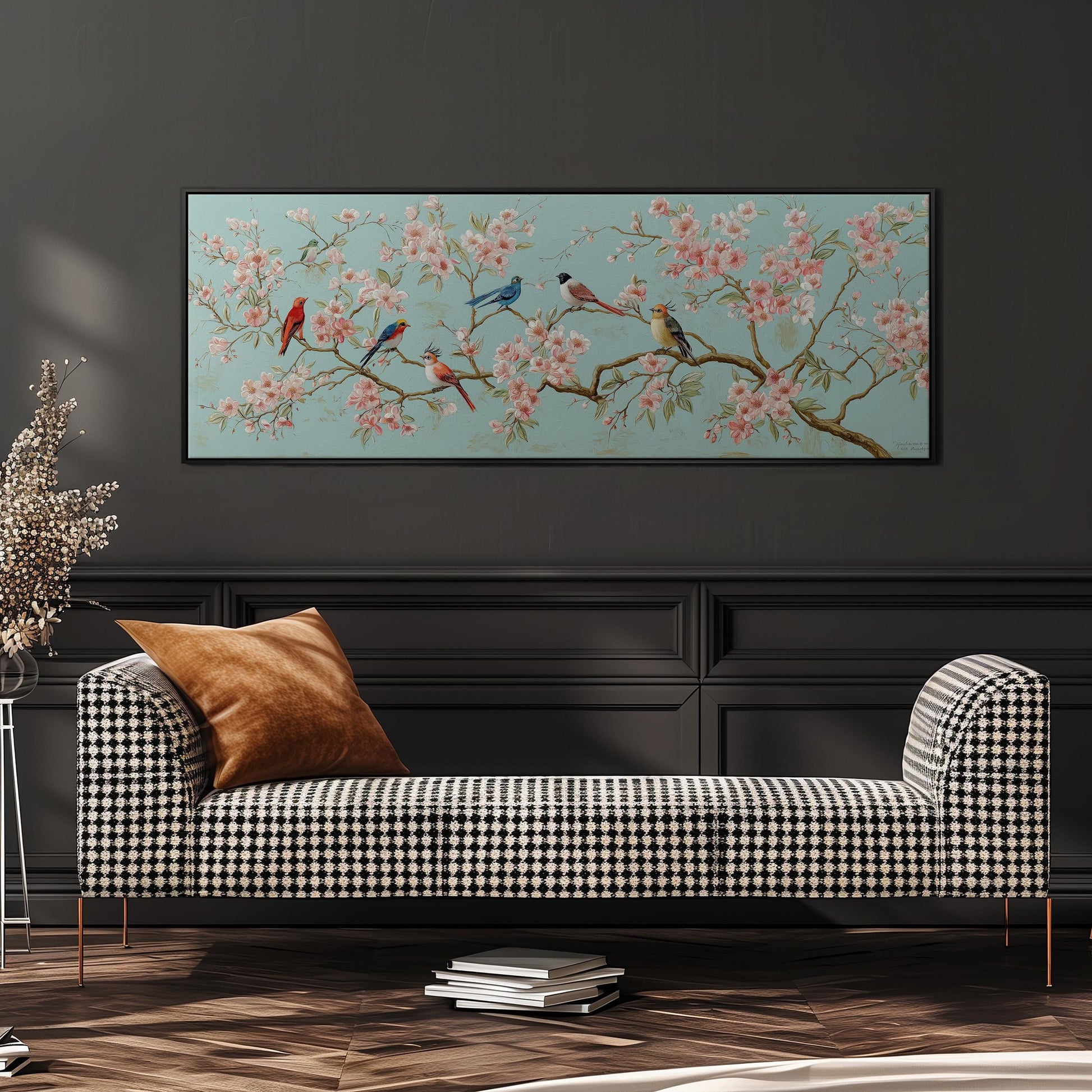 a checkered sofa with a brown throw pillow, set against a dark wall with a large floral painting hanging above it.