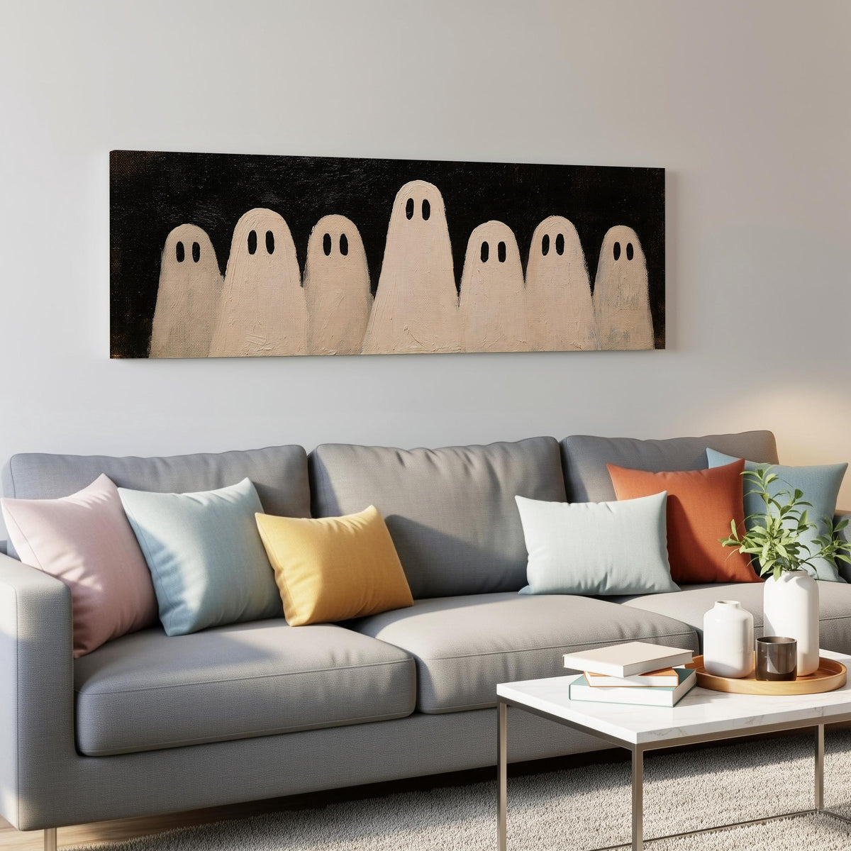 Friendly ghost gang panoramic canvas print above a grey sofa in a living room