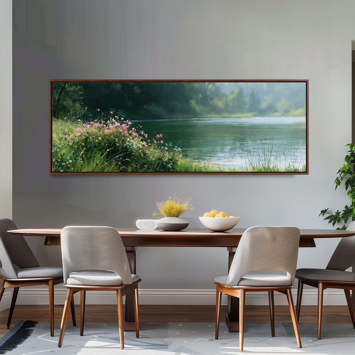 Pink wildflowers on a green lakeshore long horizontal canvas print above a dining table
