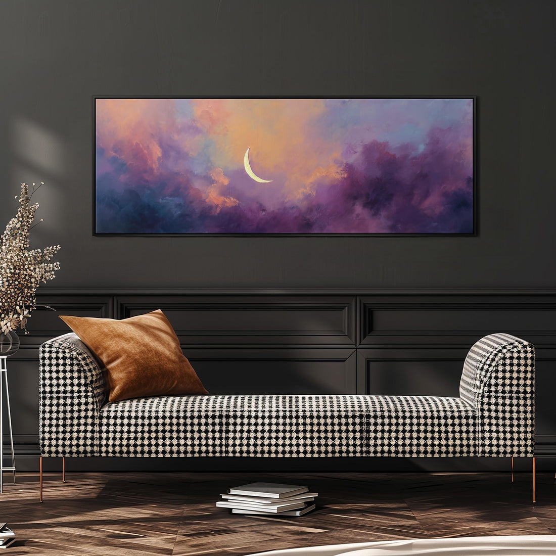 a large, rectangular painting of a crescent moon set against a colorful, cloudy sky. The painting is hanging on a wall above a black and white checkered sofa, which is positioned in front of a bookshelf. The room has a dark color scheme, with a wooden floor and a white rug on the floor.
