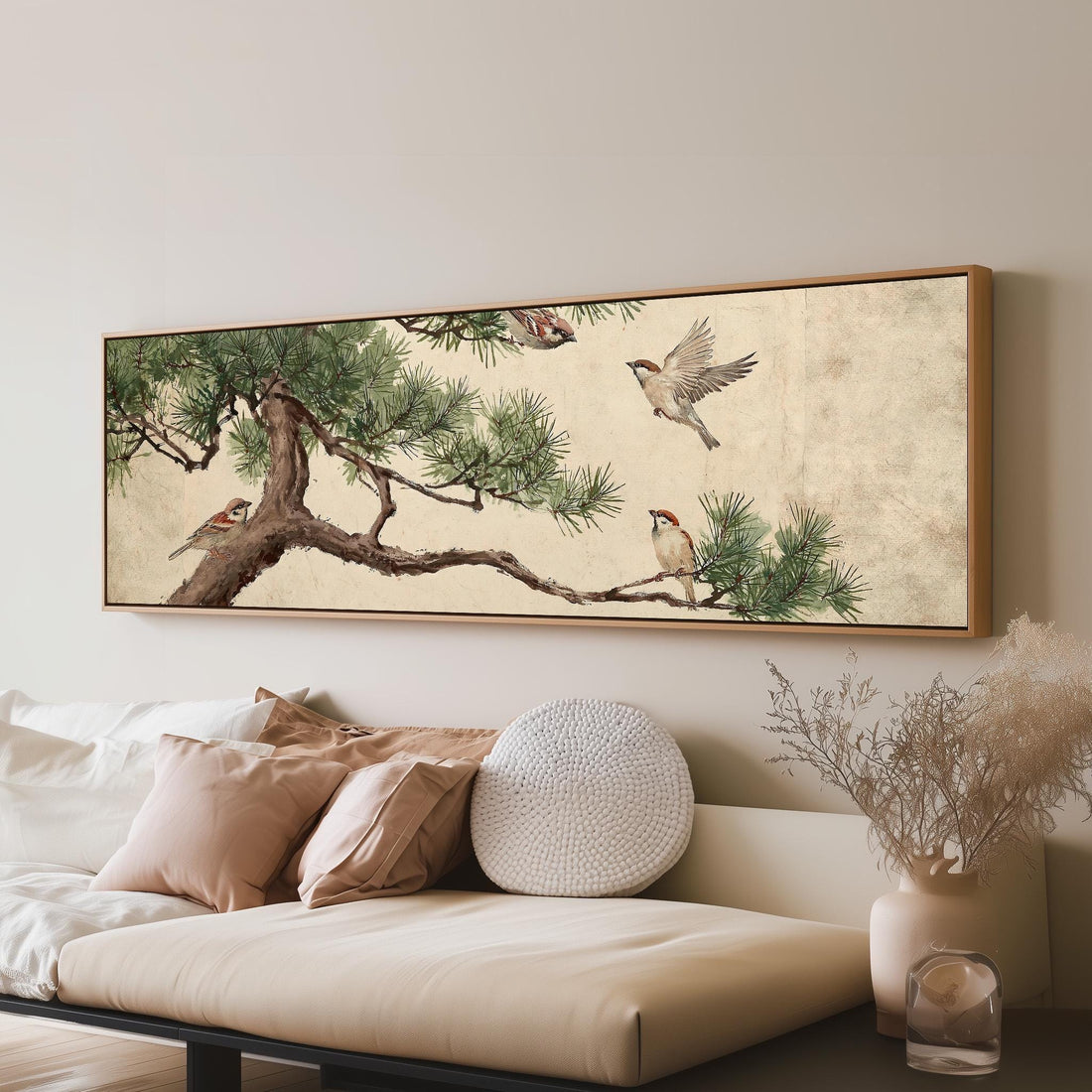 Sparrows on a pine branch long horizontal canvas print above a sofa in a living room