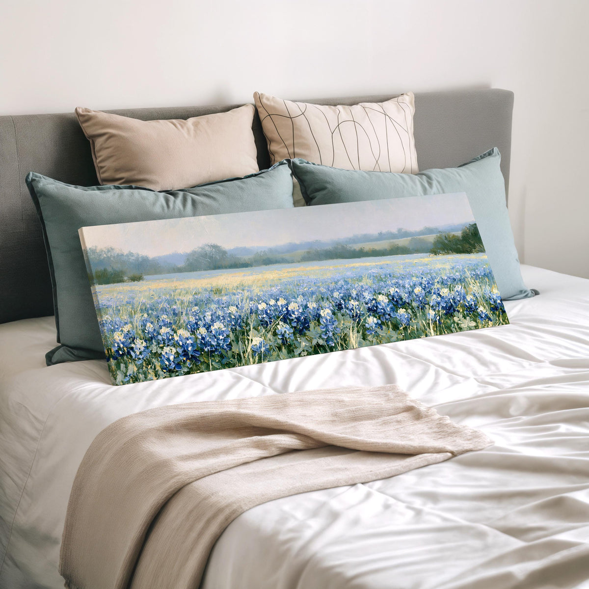 Field of bluebonnets wide panoramic canvas print laid on a bed to show its size