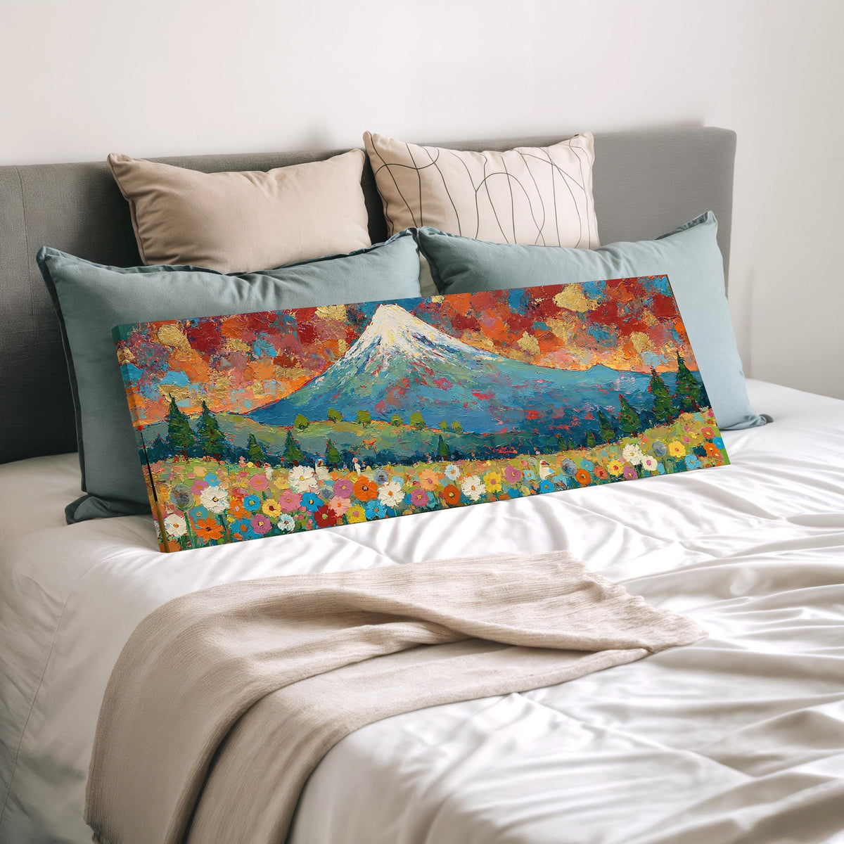Mount Fuji above autumn trees and wildflowers wide panoramic canvas print laid on a bed to show its size