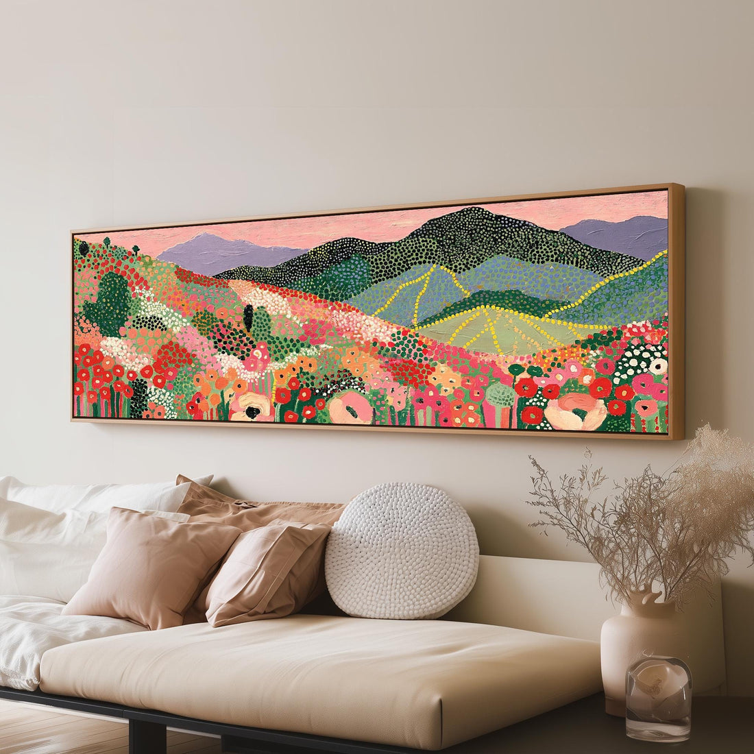 Dotted poppy mountains under a pink sky long horizontal canvas print above a sofa in a living room