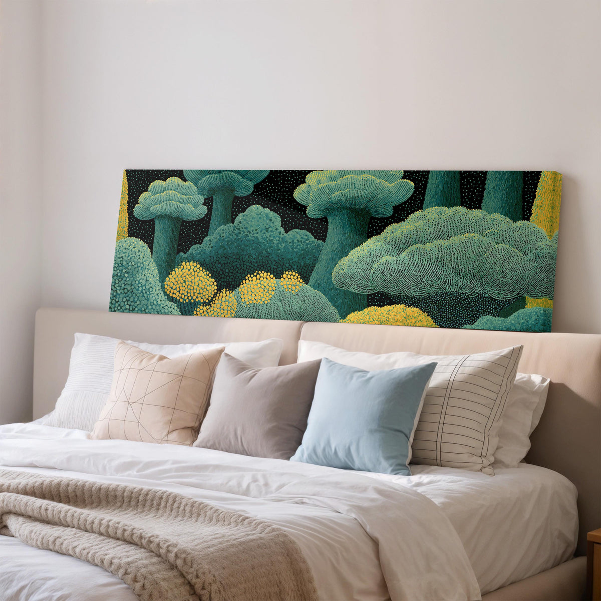 Teal dotted treetops wide panoramic canvas print above a bed in a bedroom