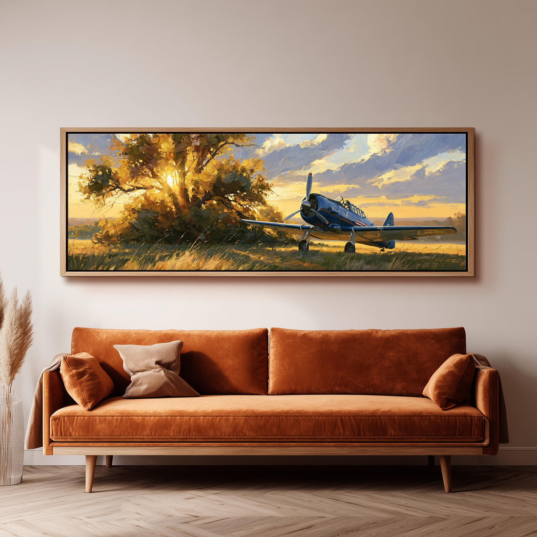 Vintage propeller plane under a tree at golden hour long horizontal canvas print above a sofa in a living room