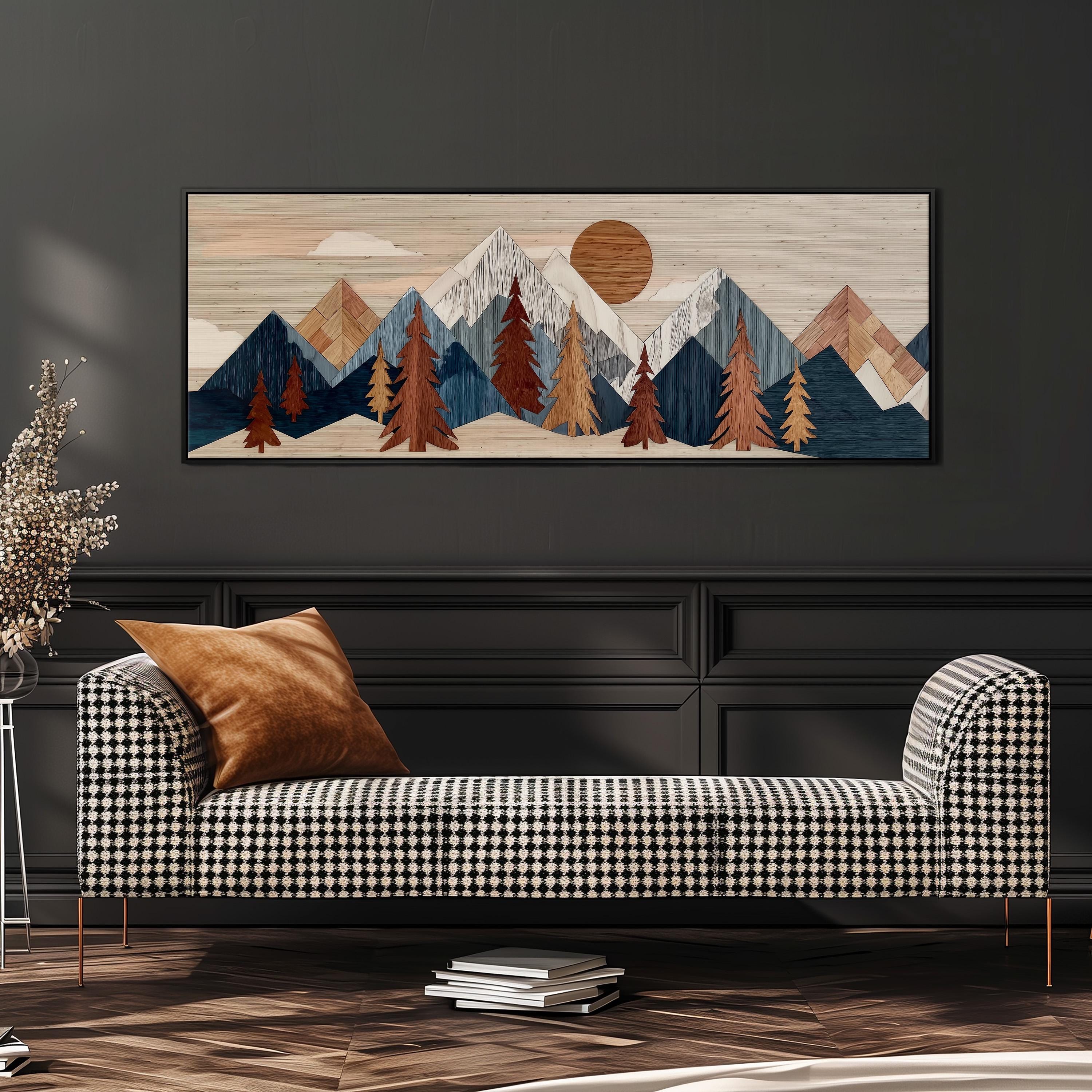 a large, rectangular artwork depicting a mountain landscape with a sun in the sky. The artwork is mounted on a wall above a black and white checkered sofa, which is positioned in front of the artwork.