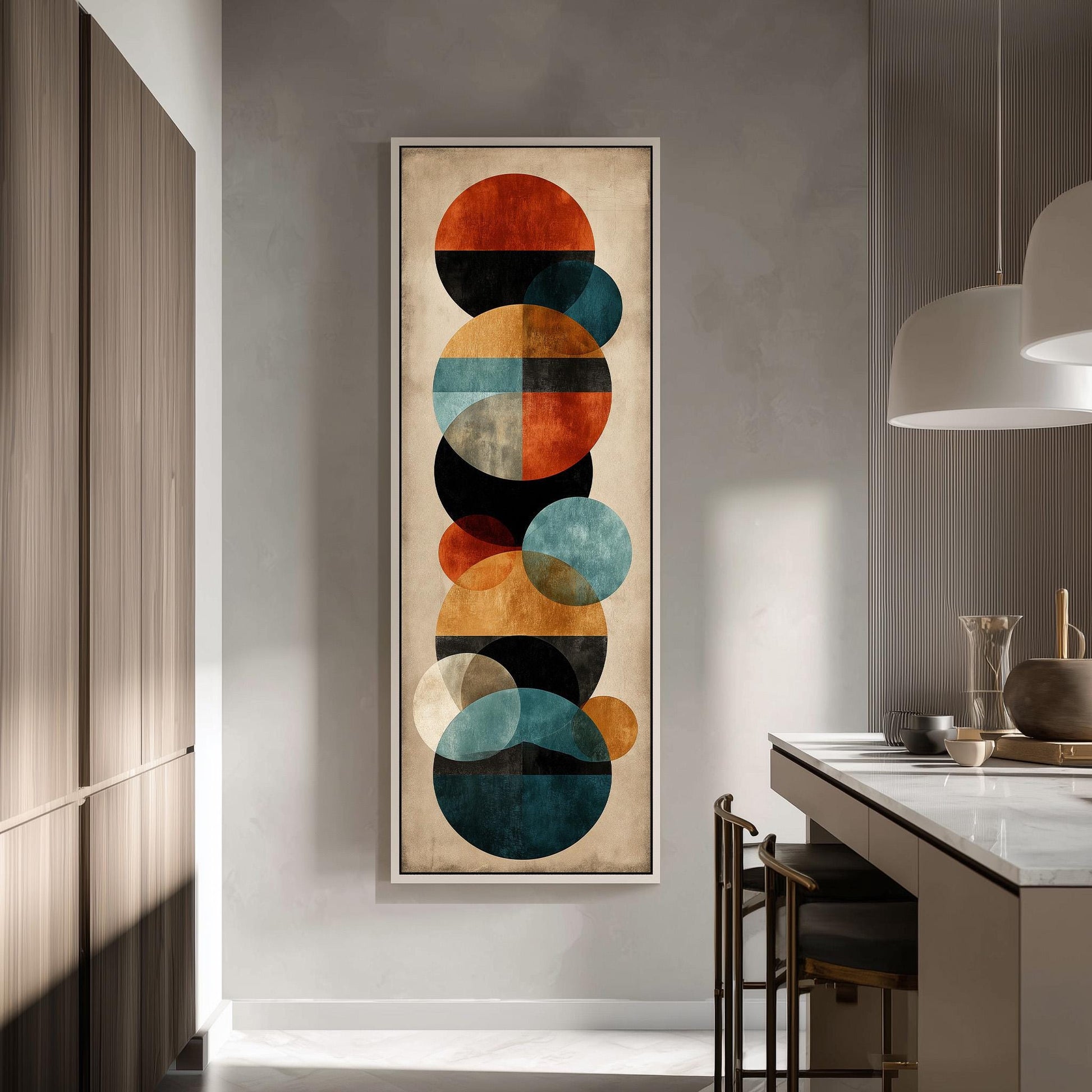 a modern kitchen with a large abstract painting hanging on the wall. The painting consists of various circles in different sizes and colors, creating a visually striking and contemporary design.