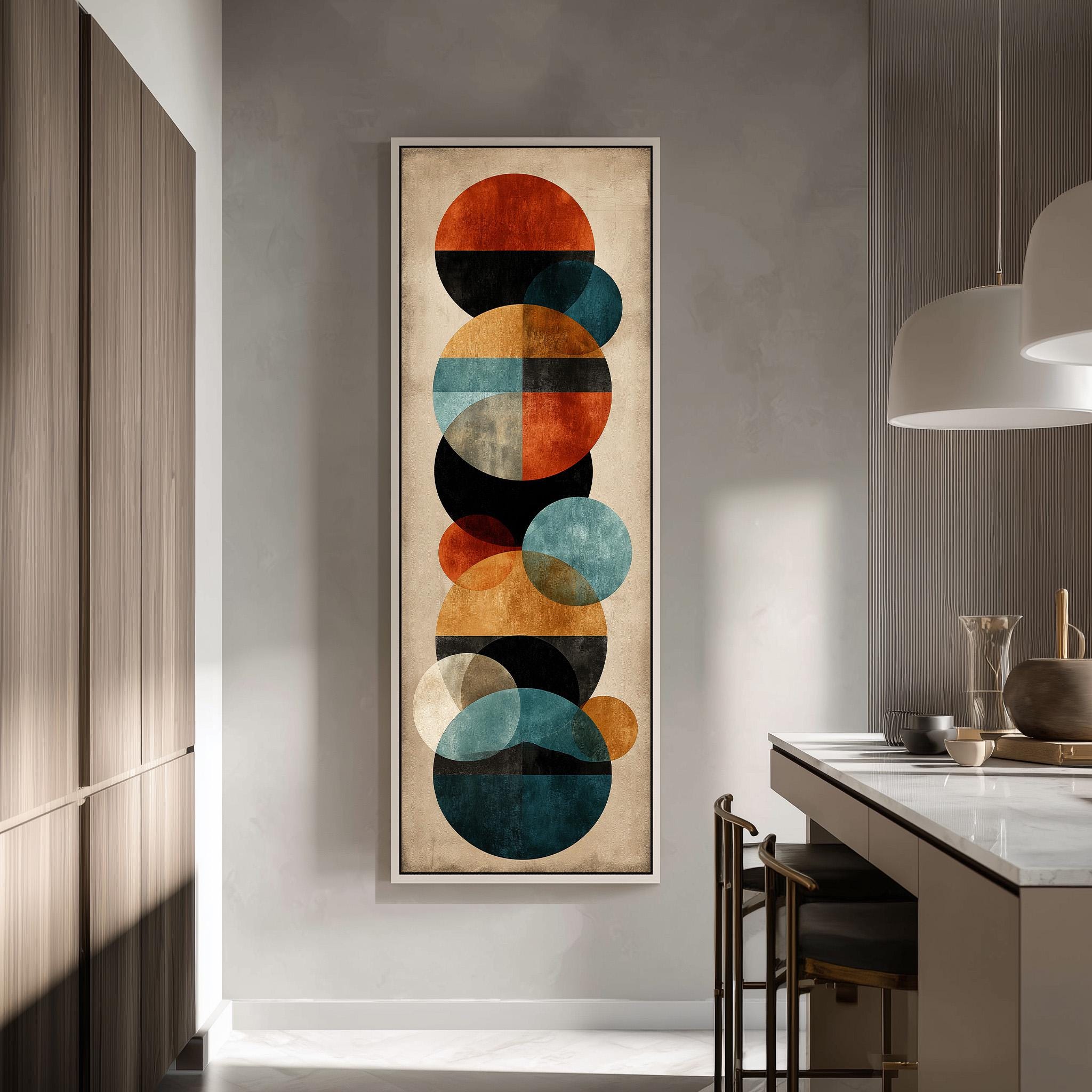a modern kitchen with a large abstract painting hanging on the wall. The painting consists of various circles in different sizes and colors, creating a visually striking and contemporary design.