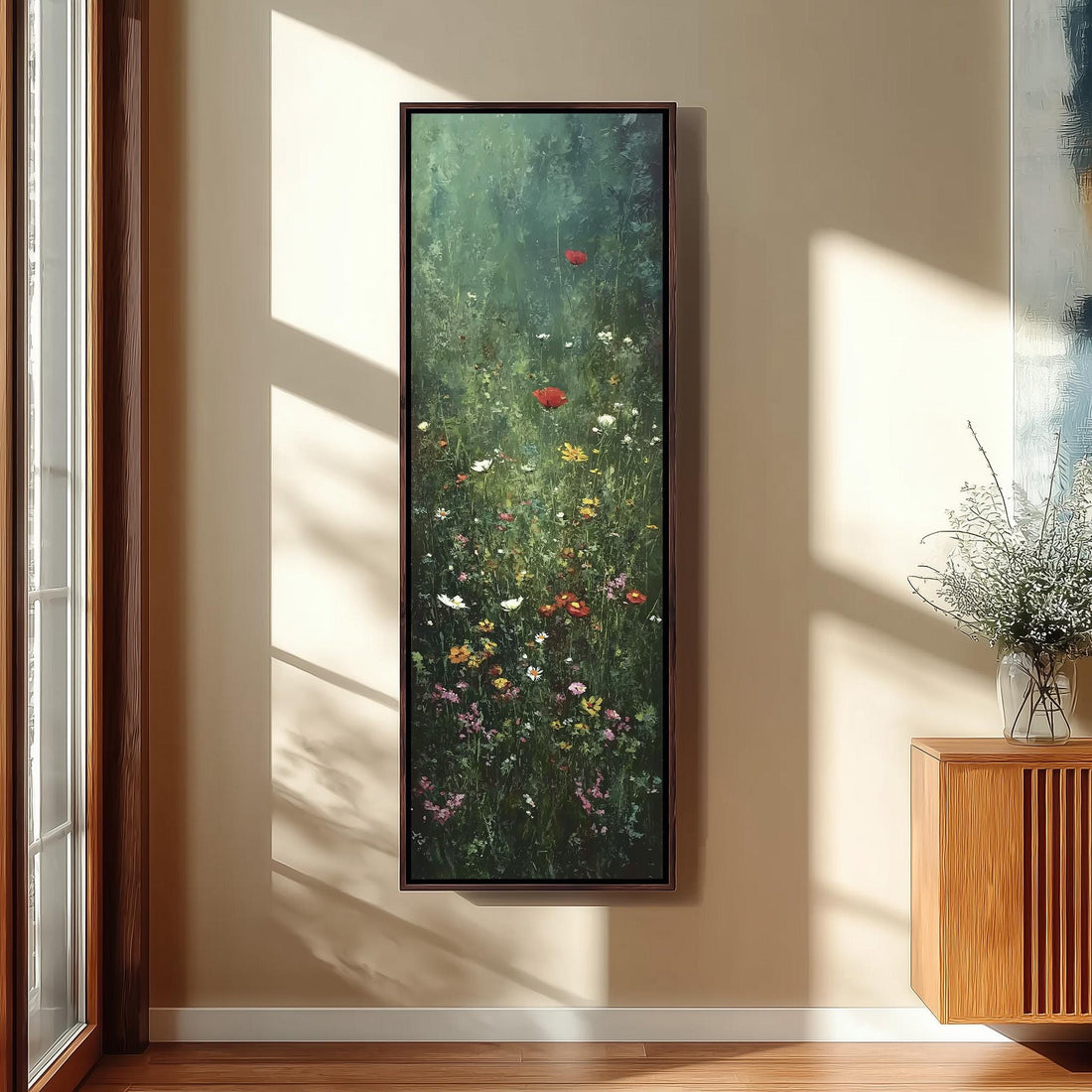 a large, framed painting of a lush, colorful garden scene hanging on a wall.