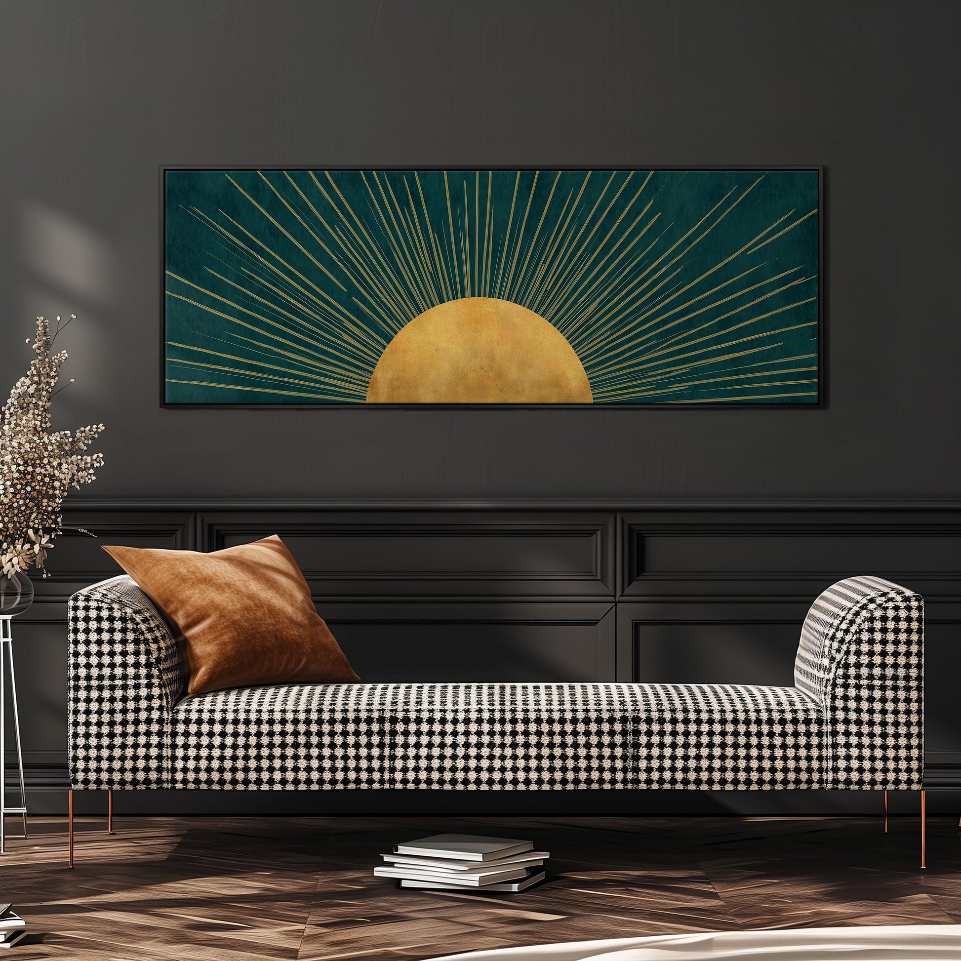 a modern living room with a black and white checkered sofa, a stack of books, and a large framed artwork depicting a sun with rays radiating from it.