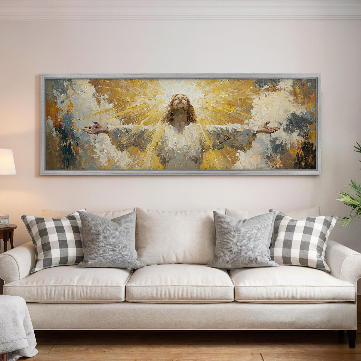 Risen Christ in golden light panoramic canvas print above a white sofa in a bright living room