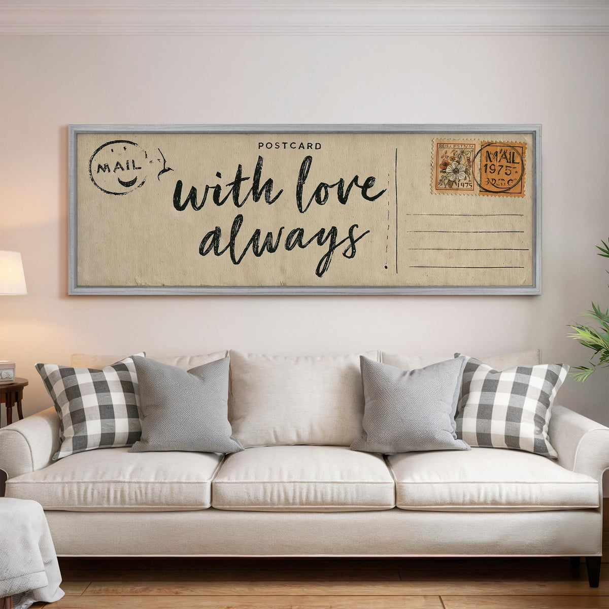 Vintage postcard saying with love always panoramic canvas print above a white sofa in a bright living room