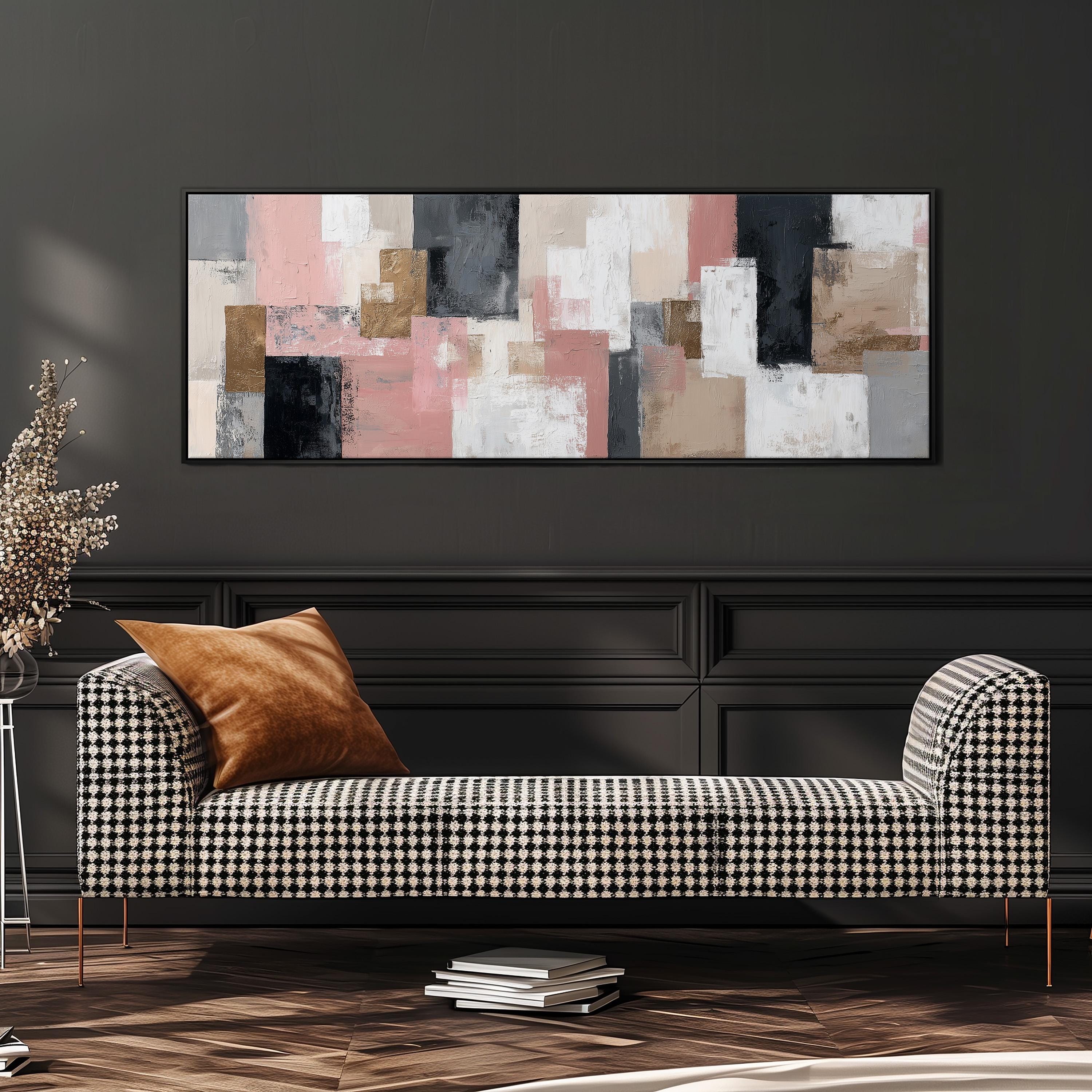 a modern living room with a black and white checkered sofa, a large abstract painting on the wall, and a stack of books on the floor.