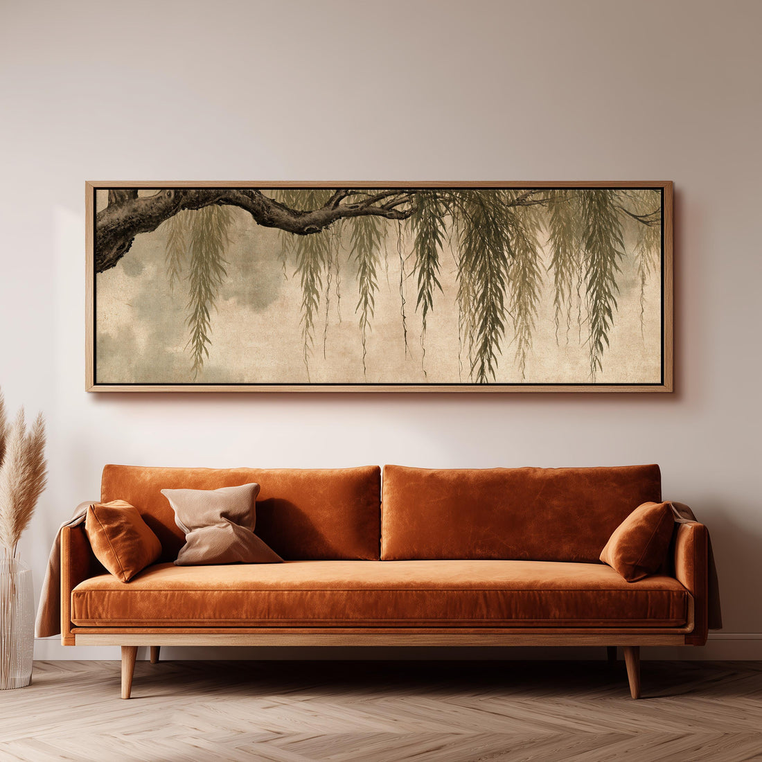 Hanging willow branches long horizontal canvas print above a sofa in a living room