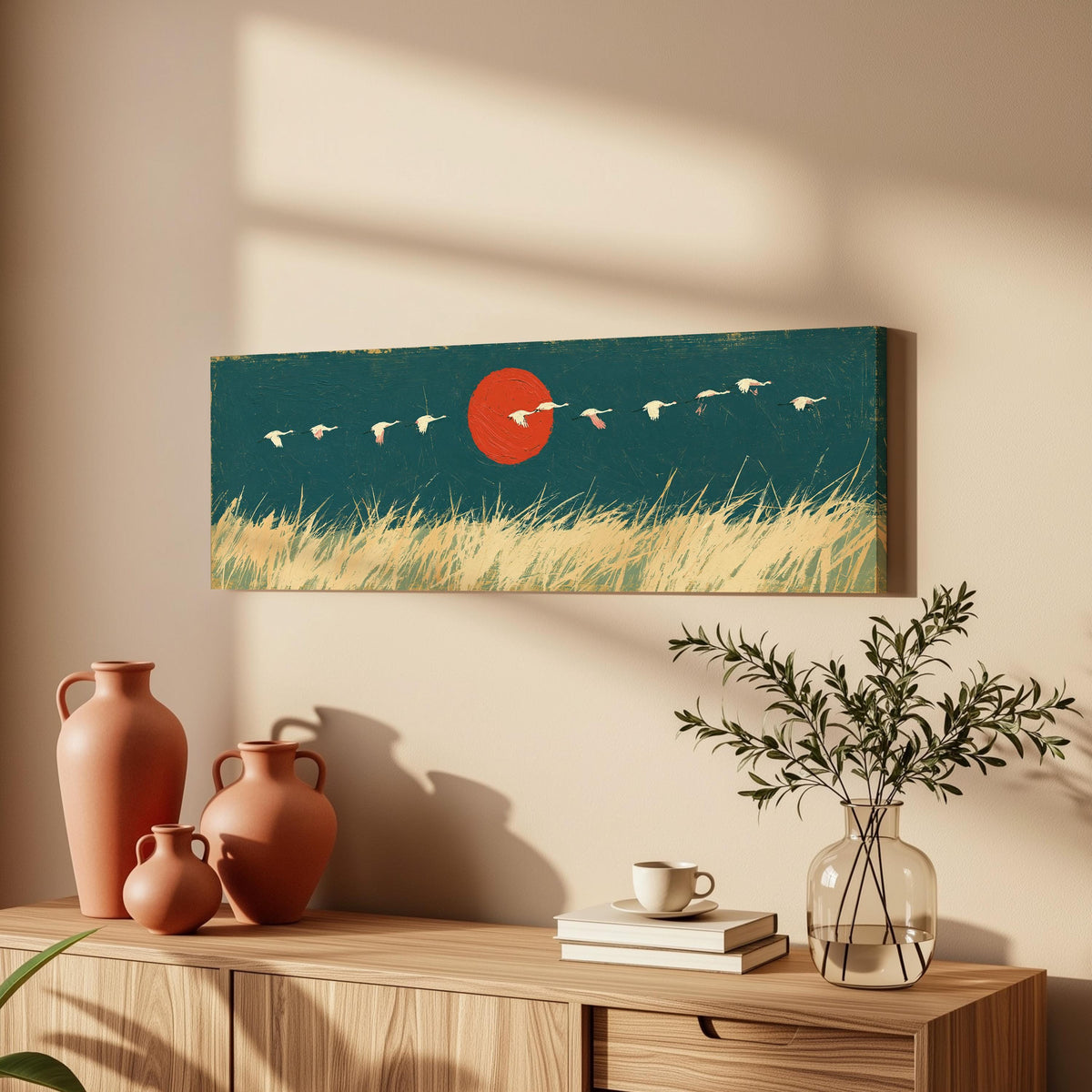 Bird flock over a prairie under a red sun long horizontal canvas print above a wooden sideboard