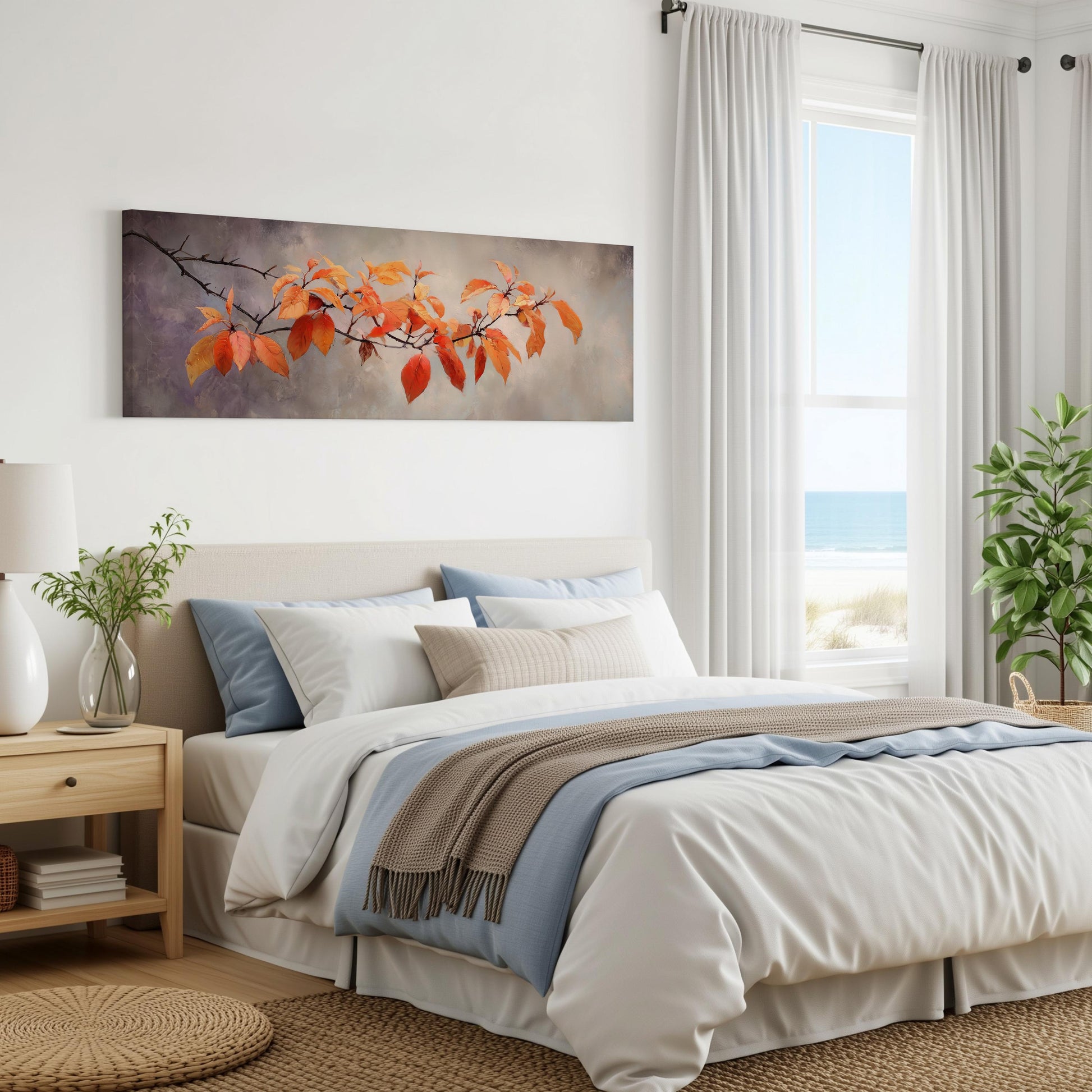 a serene bedroom with a large bed, a nightstand, and a painting of a branch with orange leaves hanging on the wall. The room has a calming and peaceful atmosphere, with natural light coming in through the window and a view of the ocean.