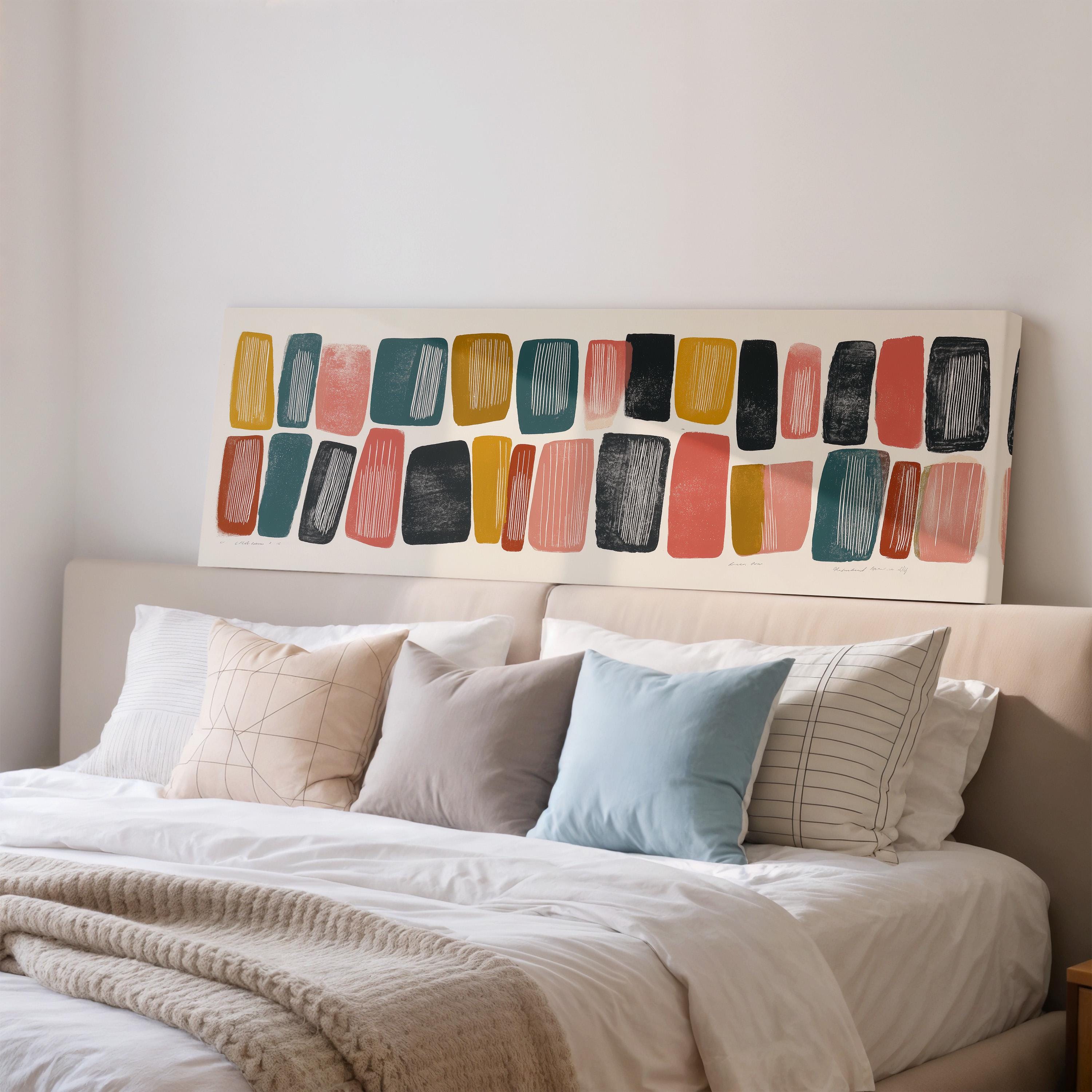 a well-made bed with a variety of colorful pillows and a large abstract painting on the wall above it.
