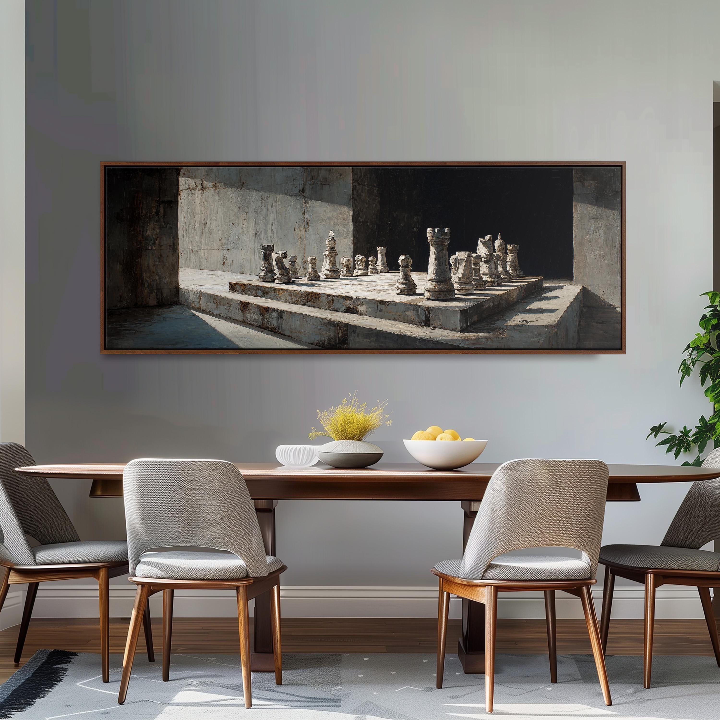 a dining room with a large painting of a chessboard hanging on the wall above a wooden dining table with four chairs. The table is set with a bowl of fruit and a vase of flowers, creating a cozy and inviting atmosphere.