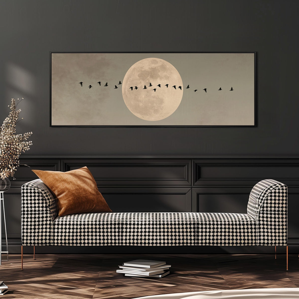 Geese crossing a full moon on grey wide panoramic canvas print above a bench in a dark living room