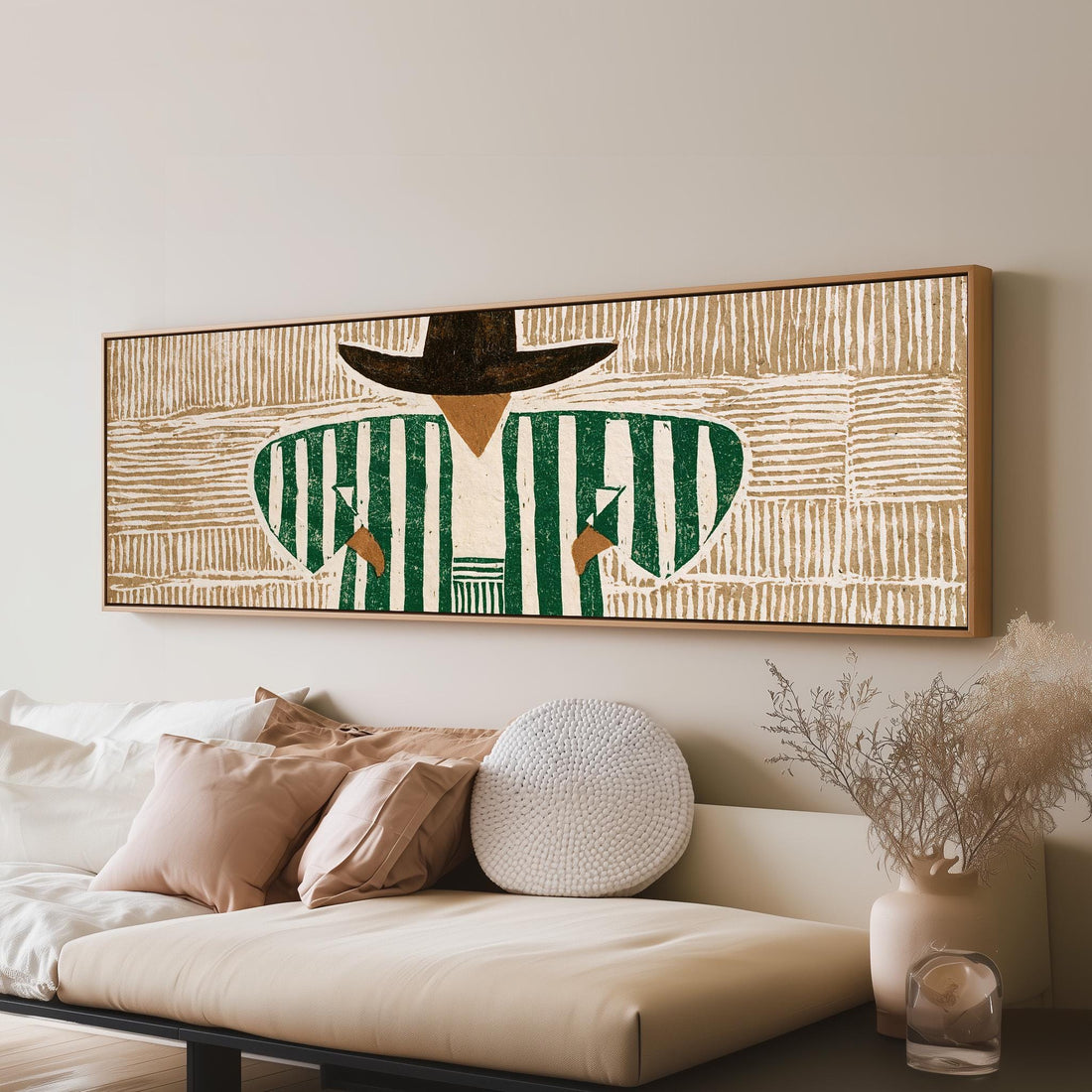 Figure in a green striped shirt and black hat long horizontal canvas print above a sofa in a living room