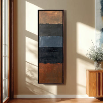 Moody color field bands in rust and navy long vertical canvas print in a sunlit living space