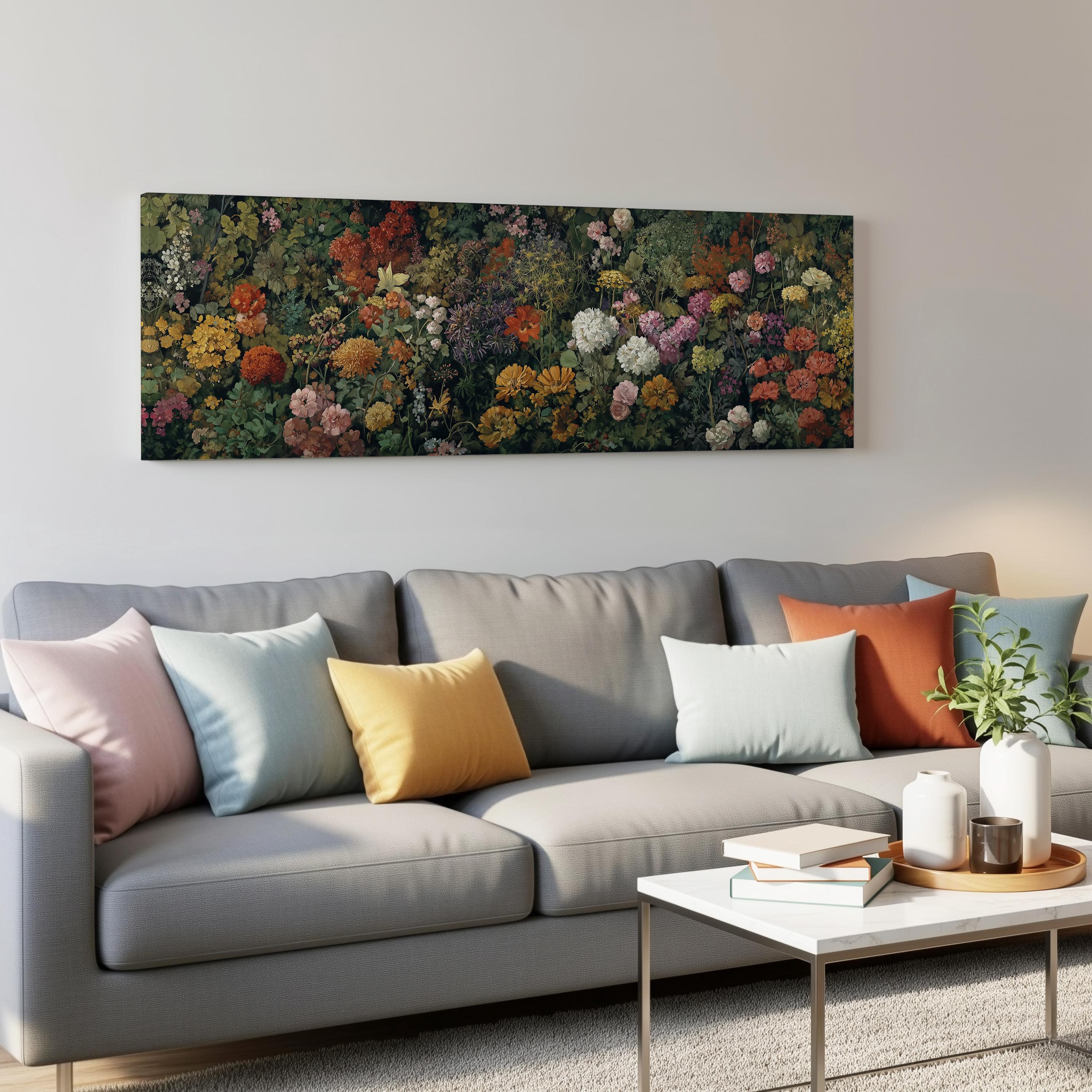 a gray couch with colorful throw pillows, a coffee table with books and a plant, and a large floral painting hanging on the wall above the couch.