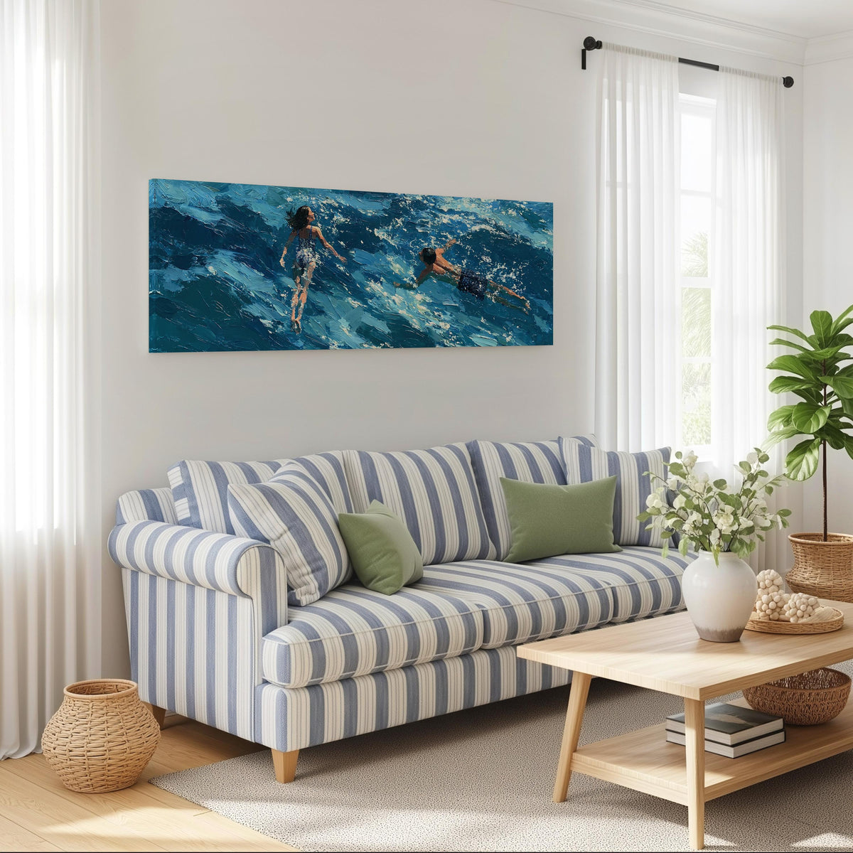 Two swimmers in turquoise waves long horizontal canvas print above a striped sofa in a coastal living room