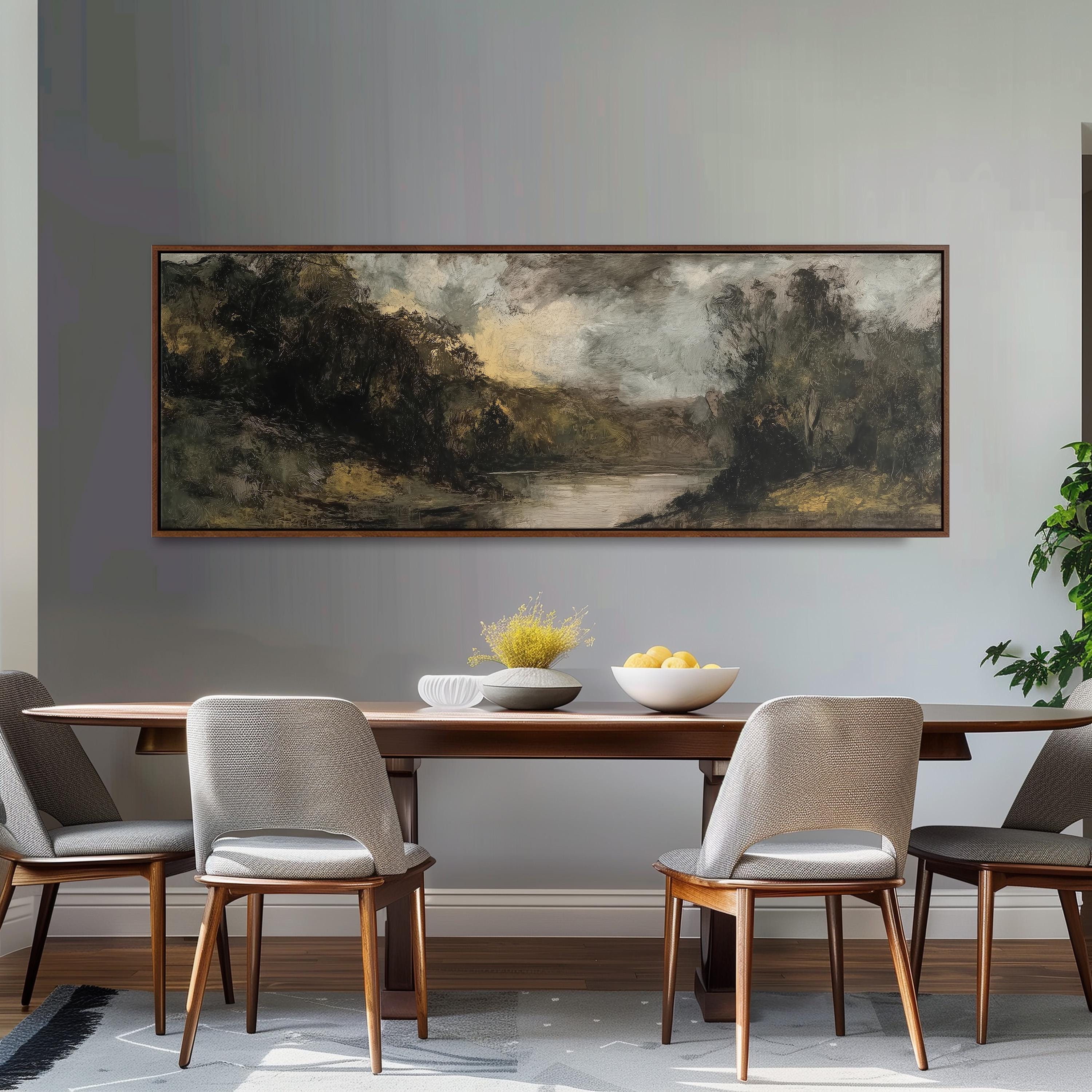 a dining room with a large painting of a landscape hanging on the wall above a wooden dining table with four chairs. The table is set with a bowl of fruit and a vase of flowers, creating a cozy and inviting atmosphere.