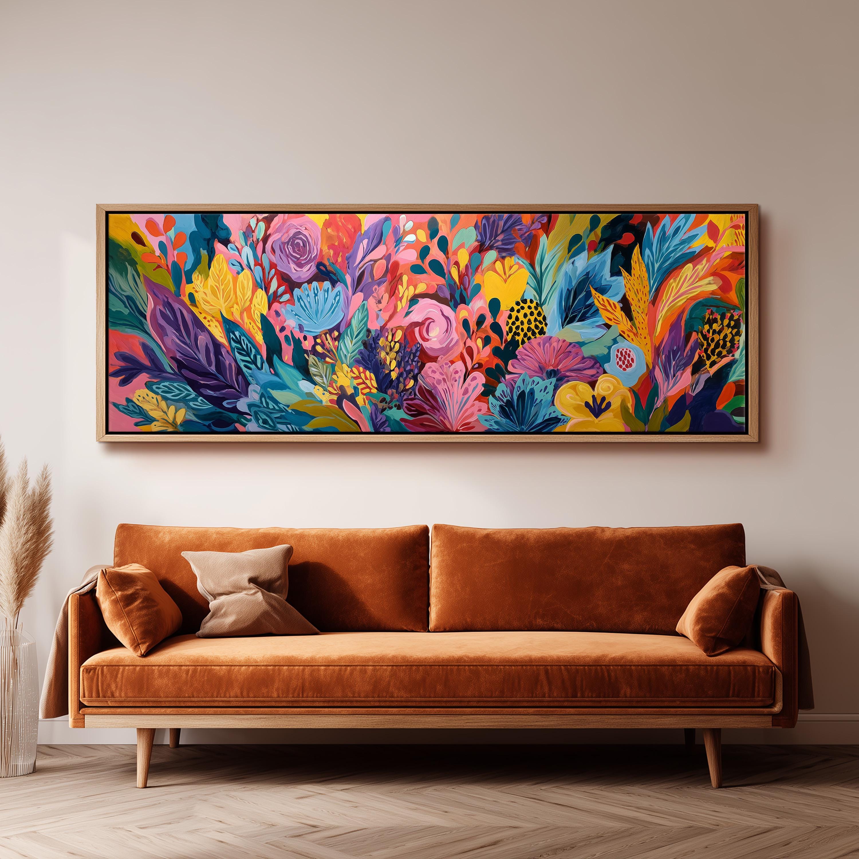 a large, colorful painting of a vibrant floral scene hanging on a wall above a brown sofa.
