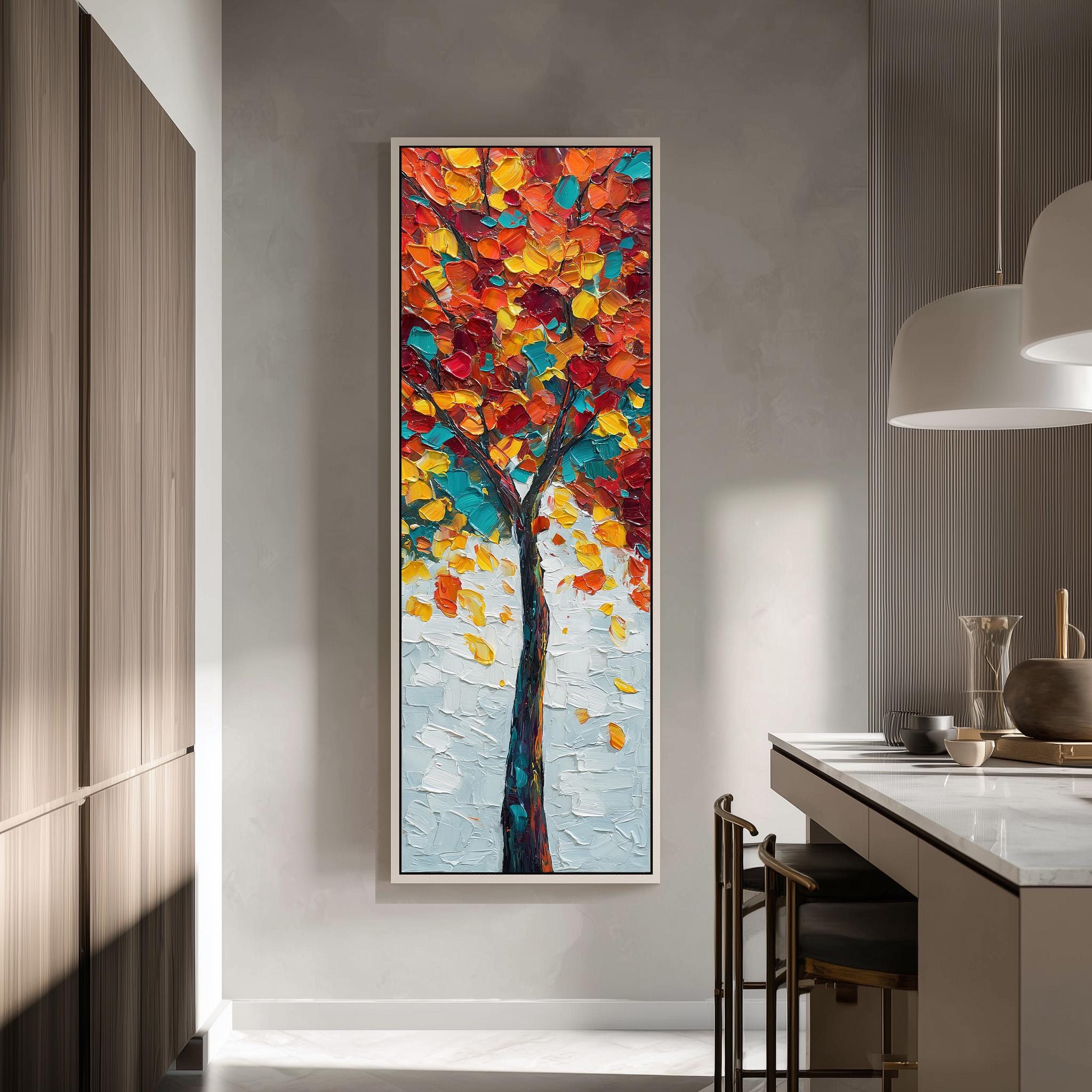 a large, colorful painting of a tree hanging on a wall in a modern kitchen.