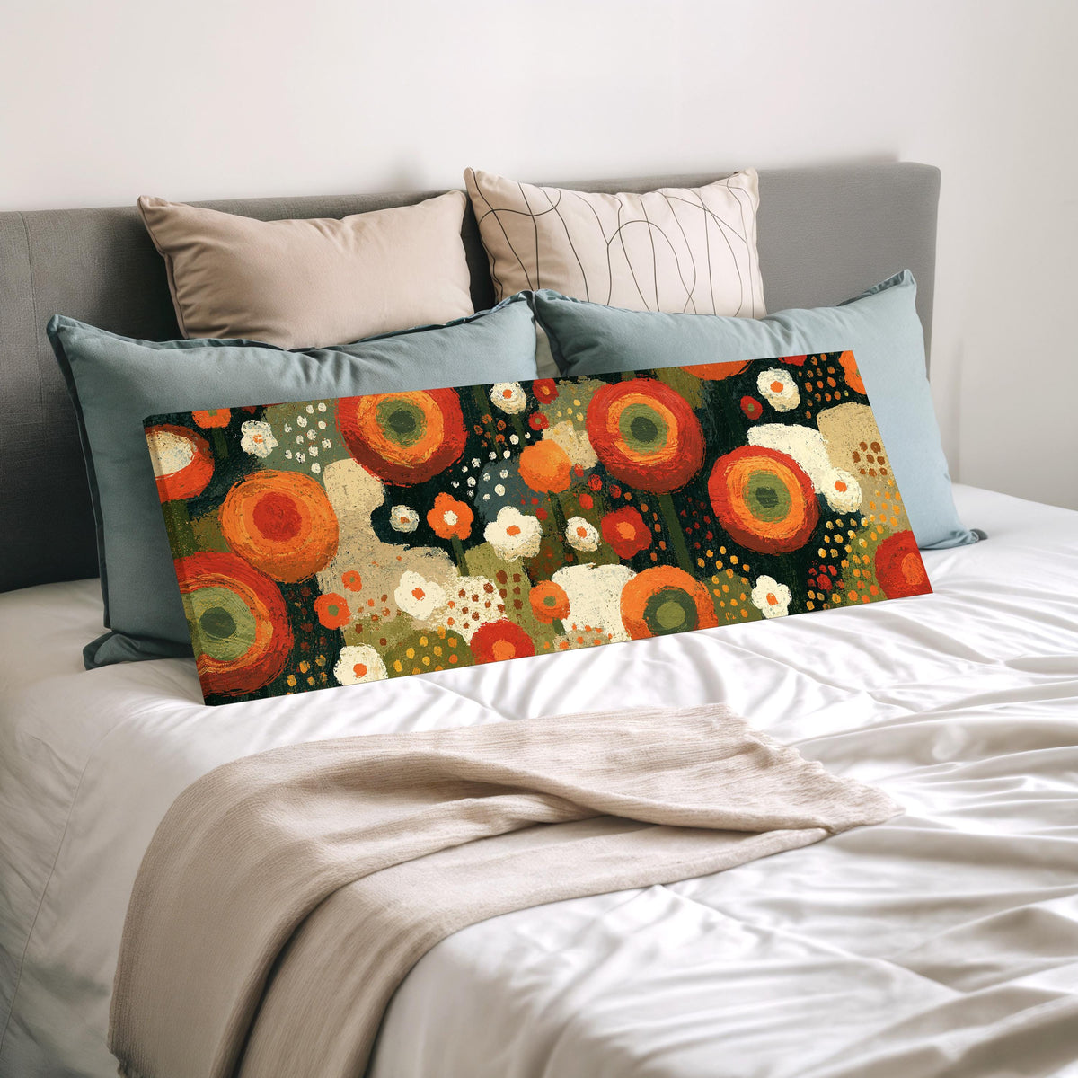 Concentric poppy rings wide panoramic canvas print laid on a bed to show its size