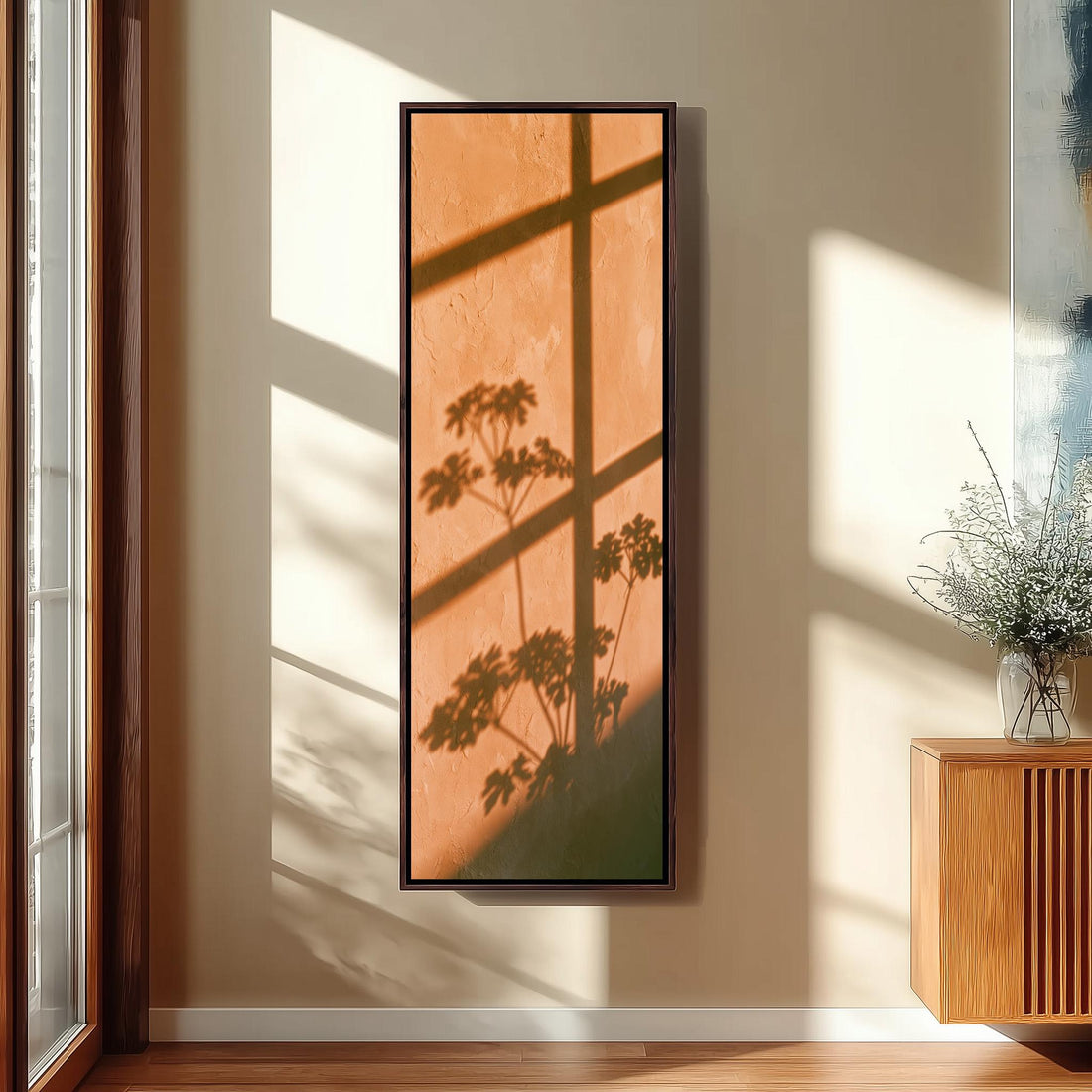 Leaf and window shadow on a terracotta wall long vertical canvas print in a sunlit living space