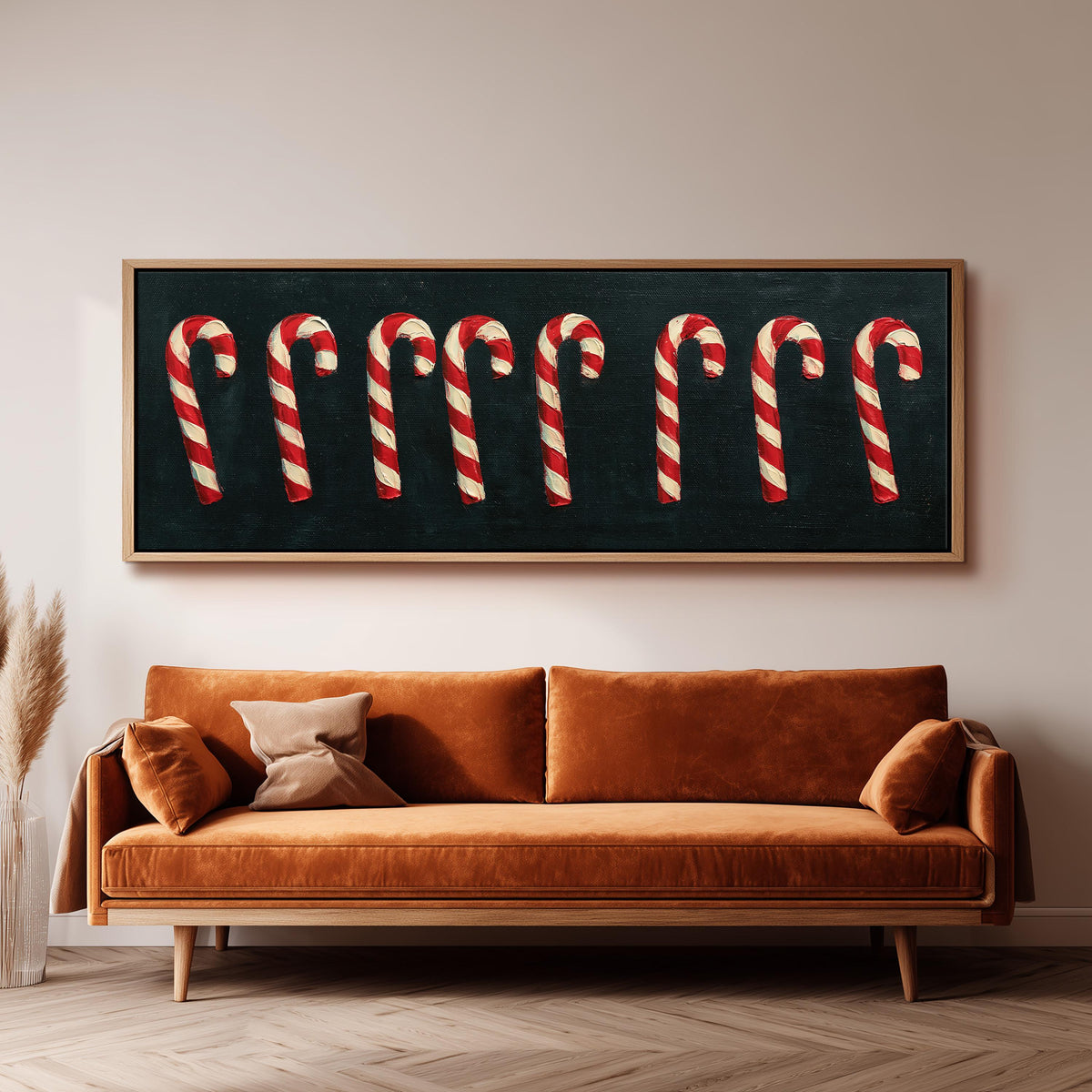 Row of candy canes on black wide panoramic canvas print above a bench in a dark living room