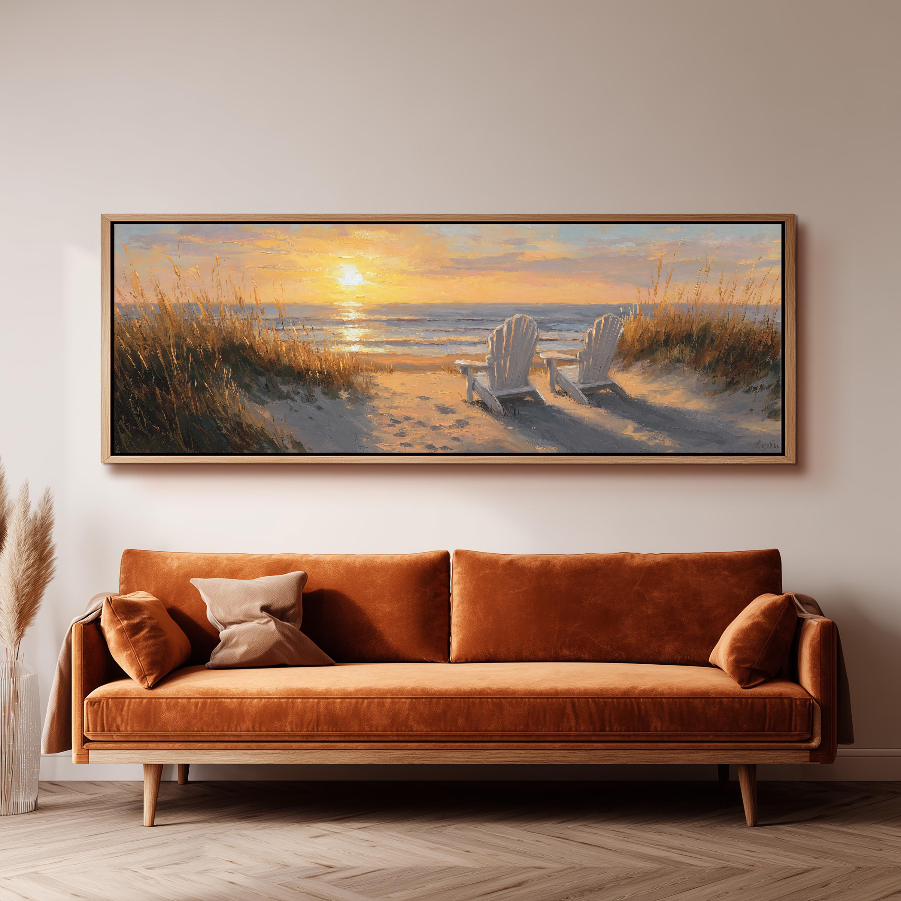 a large painting of a beach scene with two white chairs and a sunset in the background, hanging on a wall above a brown sofa.
