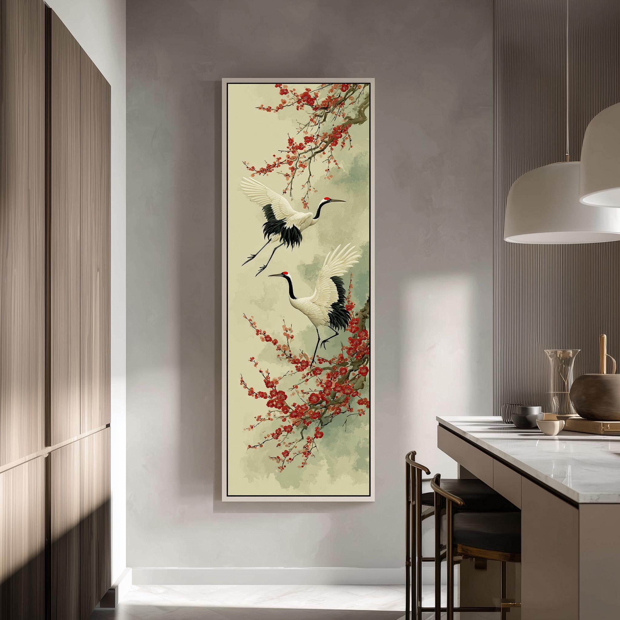 a large framed painting of two white birds with black and red accents, standing on branches with red flowers, hanging on a wall in a modern kitchen.